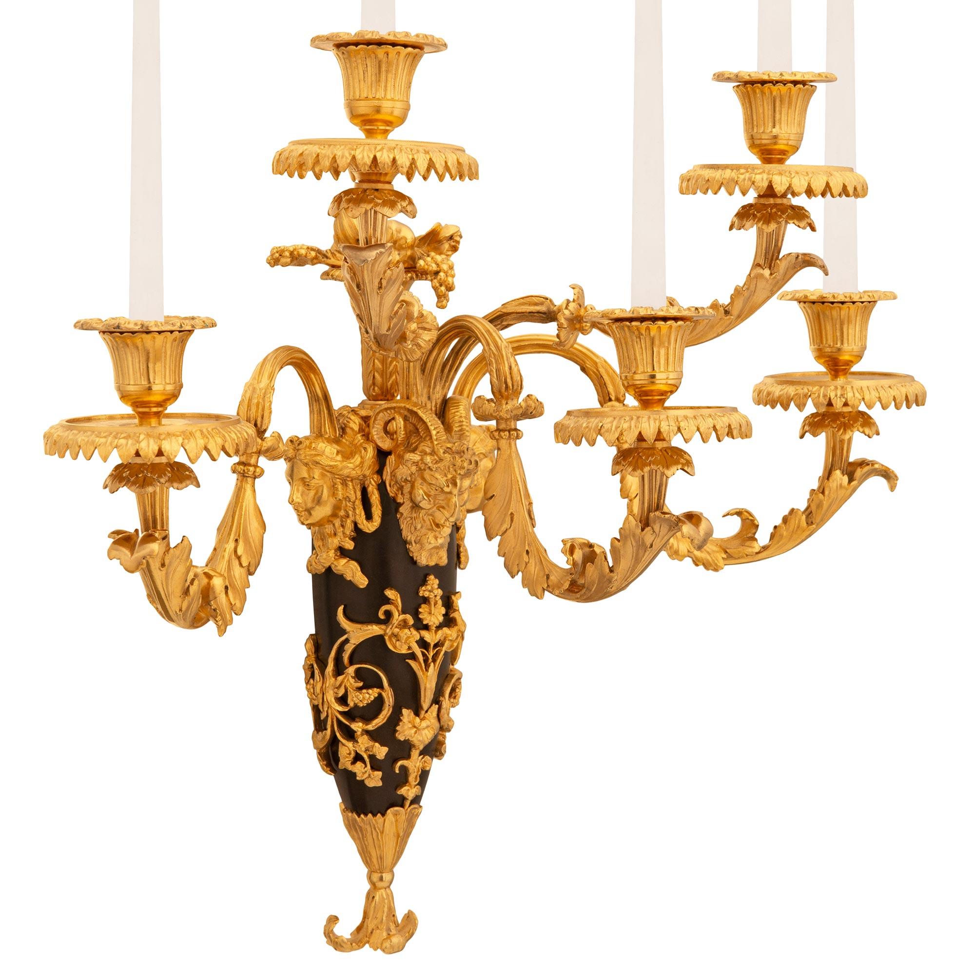 pair of French 19th century Louis XVI st. Ormolu and patinated Bronze sconces In Good Condition For Sale In West Palm Beach, FL
