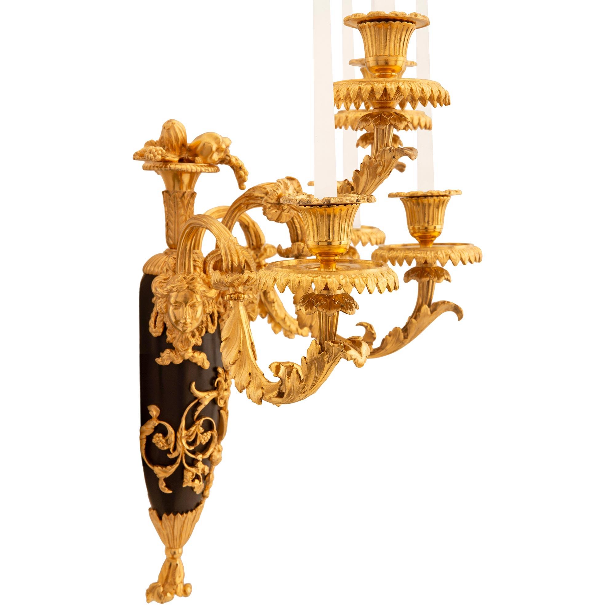 19th Century pair of French 19th century Louis XVI st. Ormolu and patinated Bronze sconces For Sale