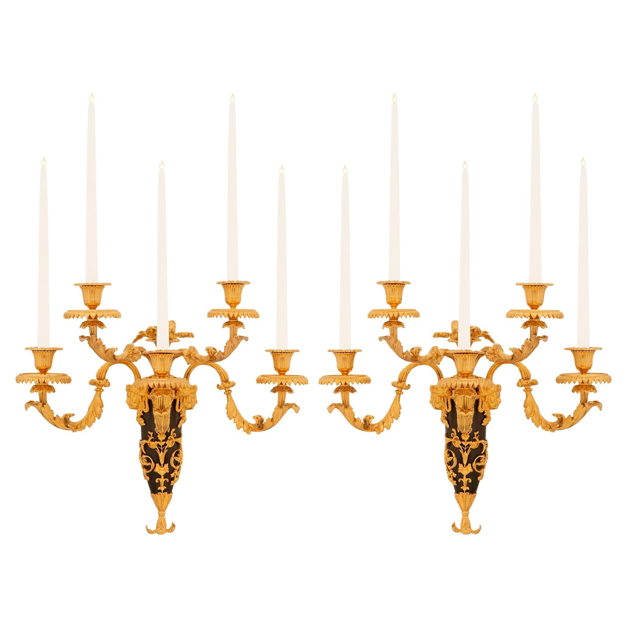 pair of French 19th century Louis XVI st. Ormolu and patinated Bronze sconces For Sale