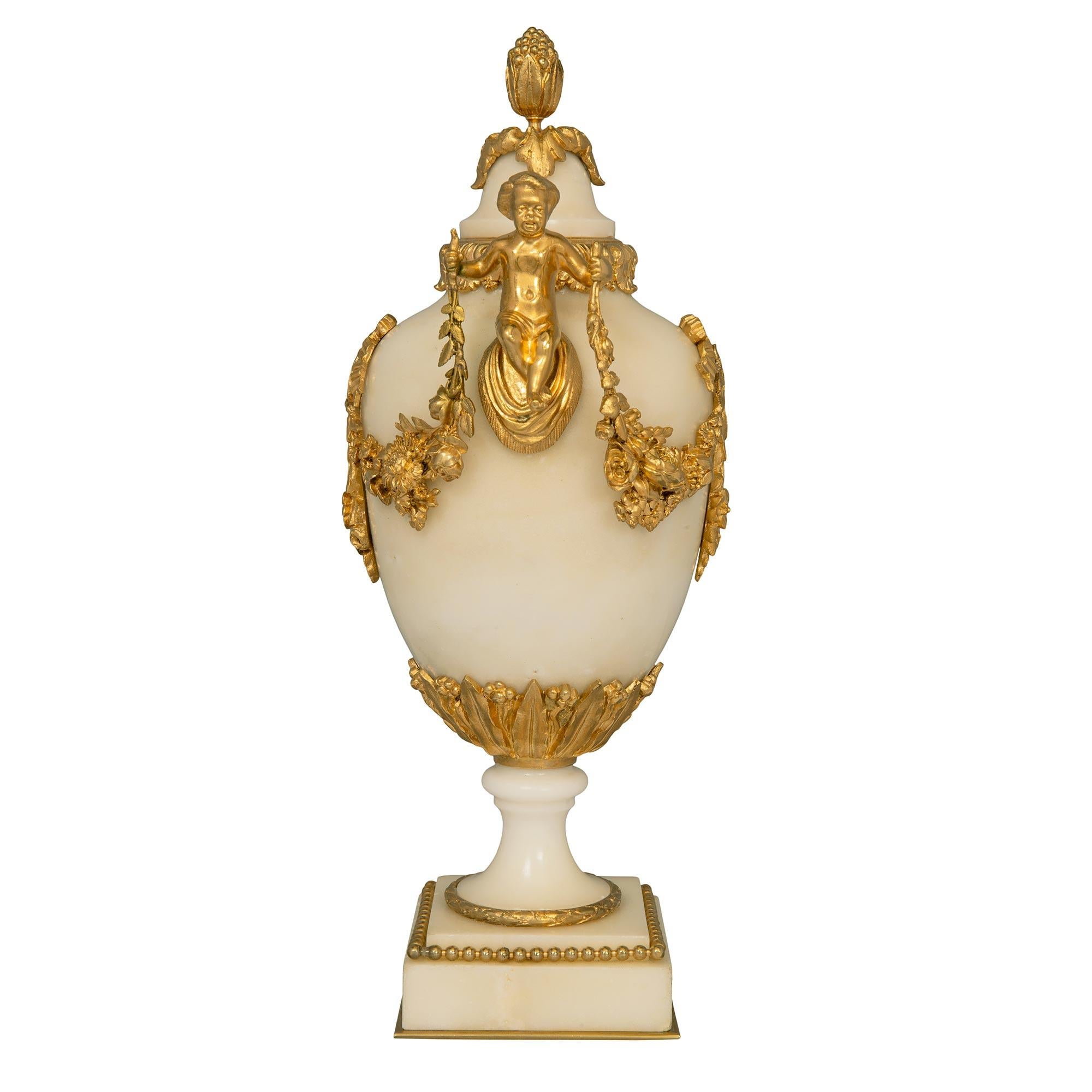 Pair of French 19th Century Louis XVI St. Ormolu and White Carrara Marble Urns In Good Condition In West Palm Beach, FL