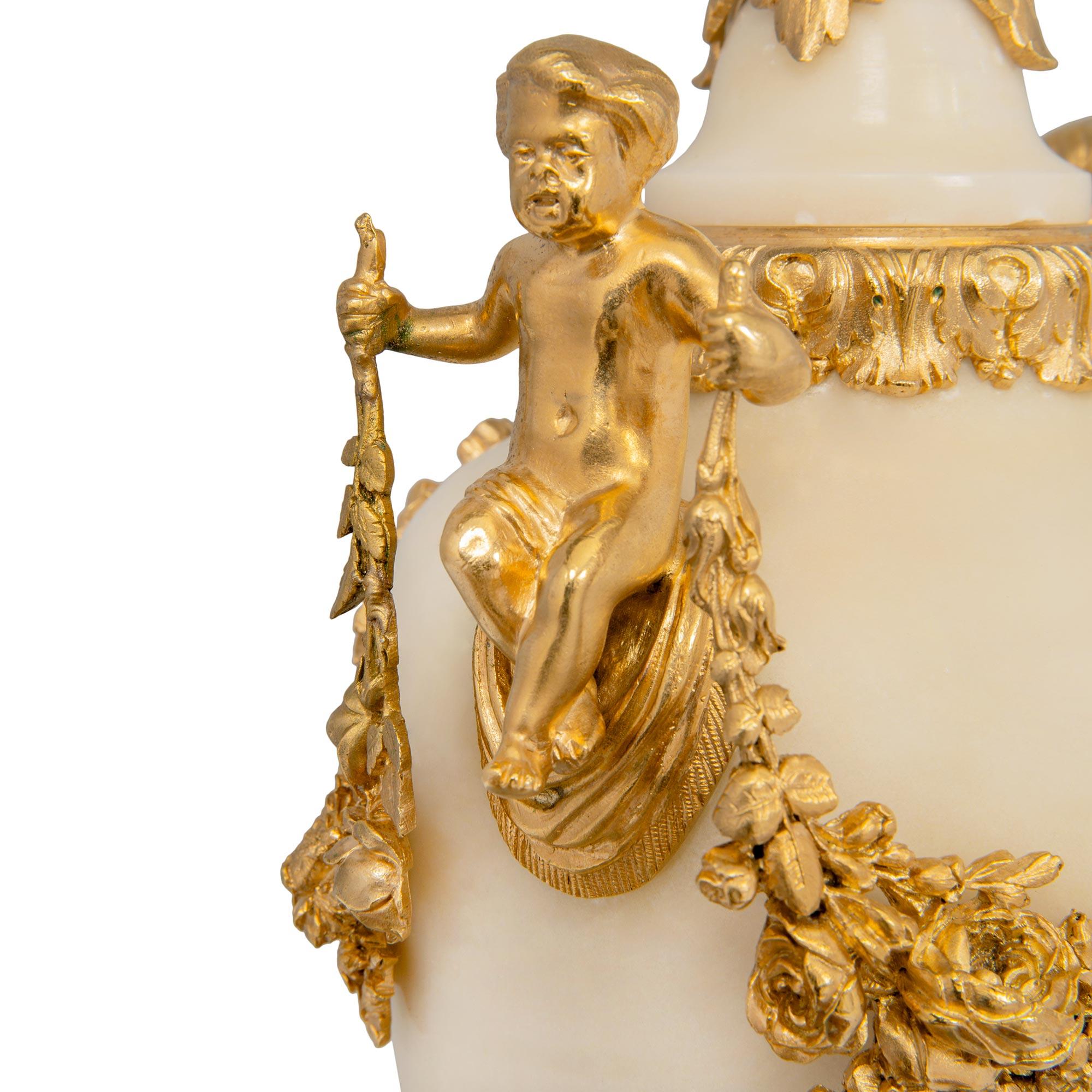 Pair of French 19th Century Louis XVI St. Ormolu and White Carrara Marble Urns 2