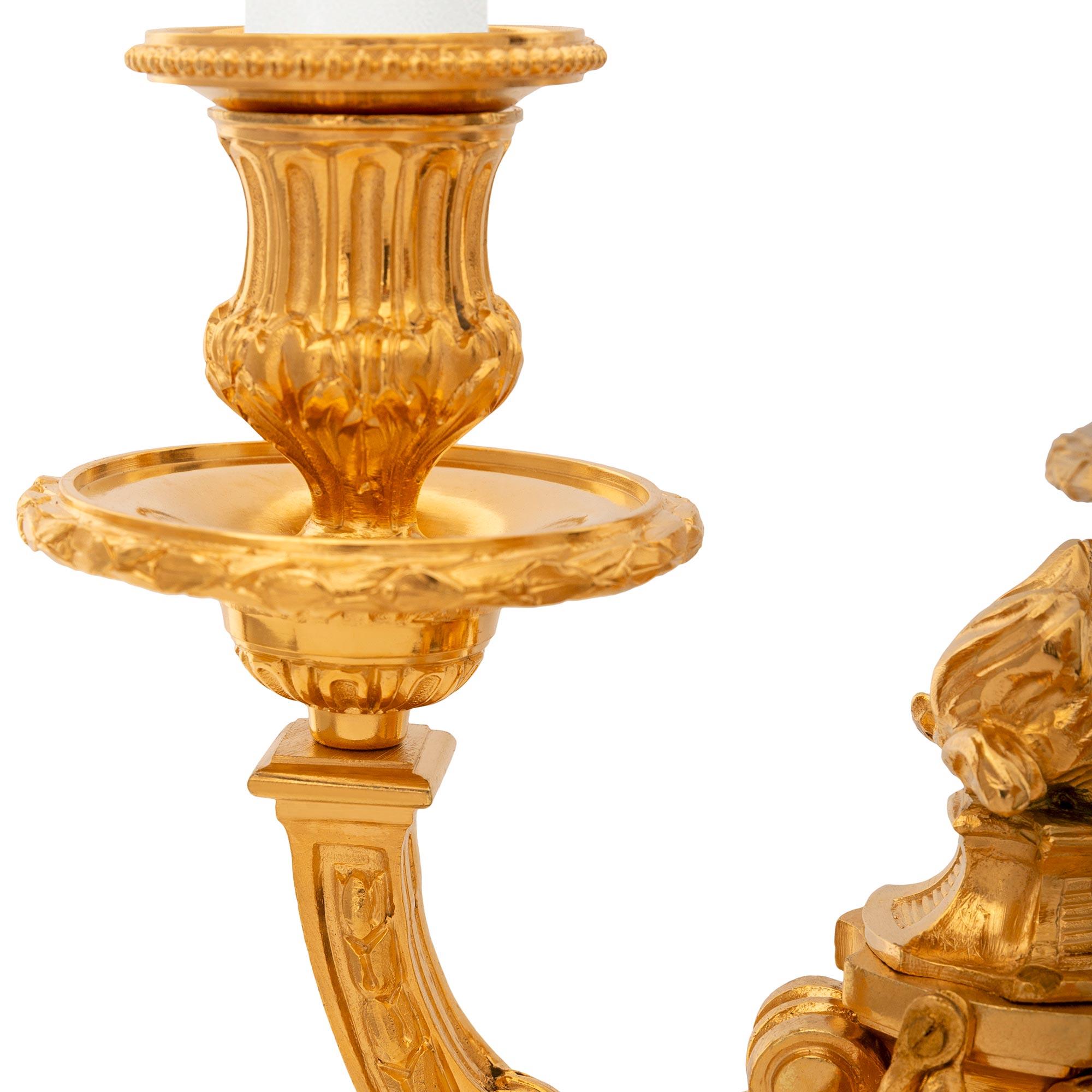 19th Century pair of French 19th century Louis XVI st. Ormolu candelabras For Sale
