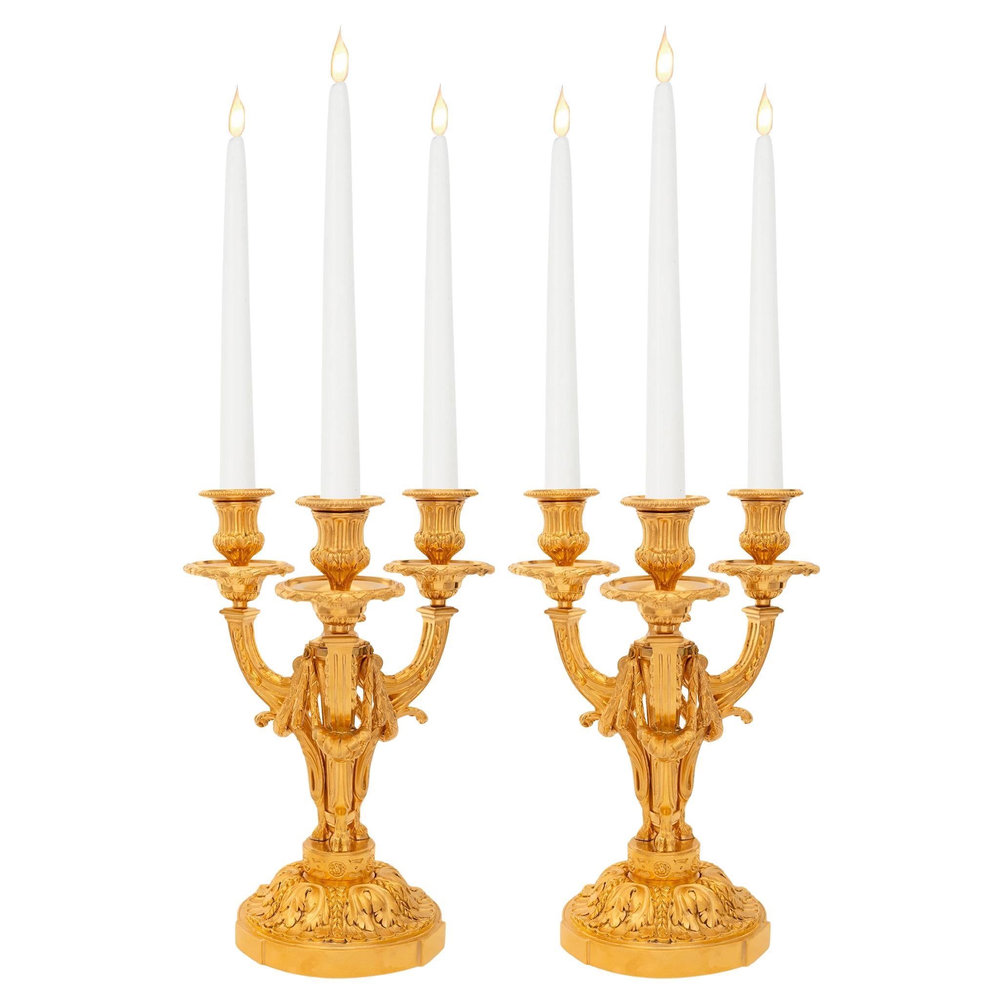 pair of French 19th century Louis XVI st. Ormolu candelabras For Sale