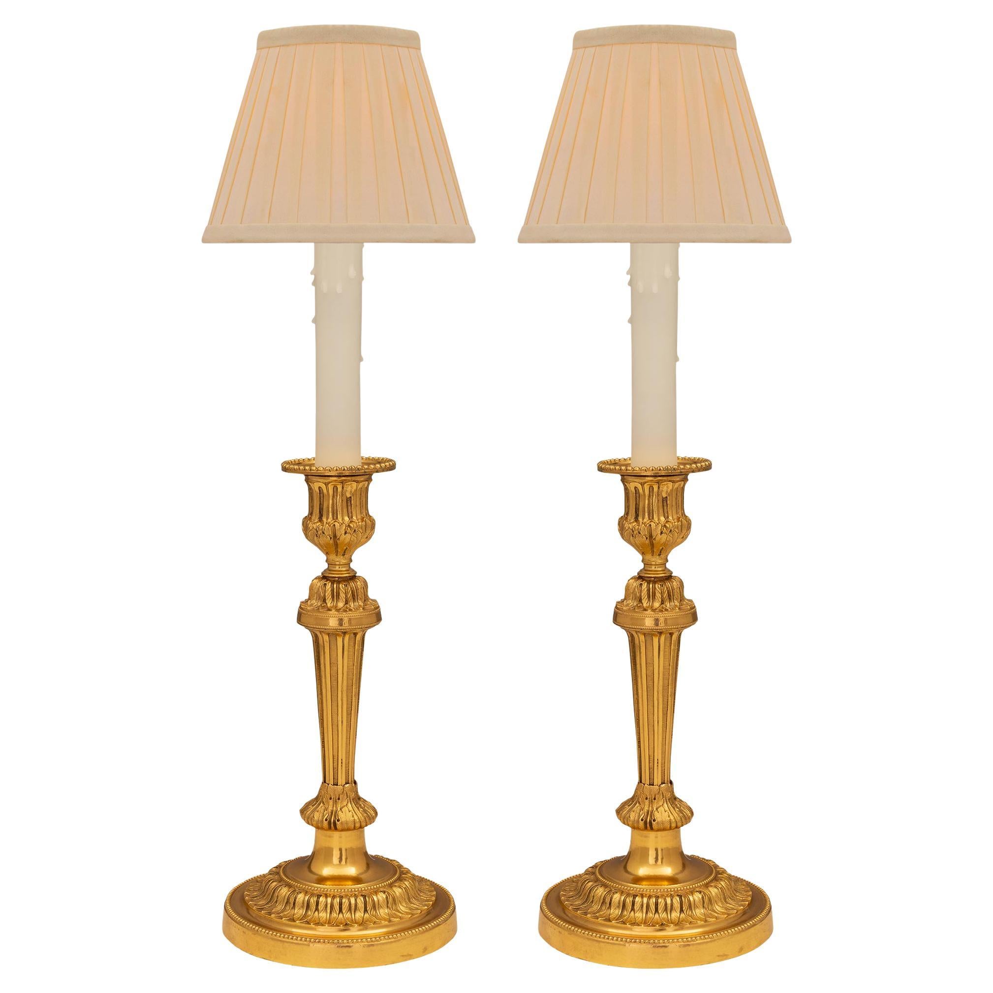 Pair of French 19th Century Louis XVI St. Ormolu Candlestick Lamps