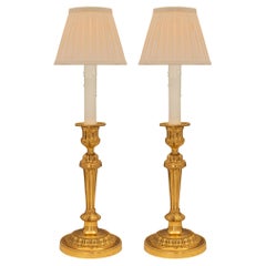 Pair of French 19th Century Louis XVI St. Ormolu Candlestick Lamps