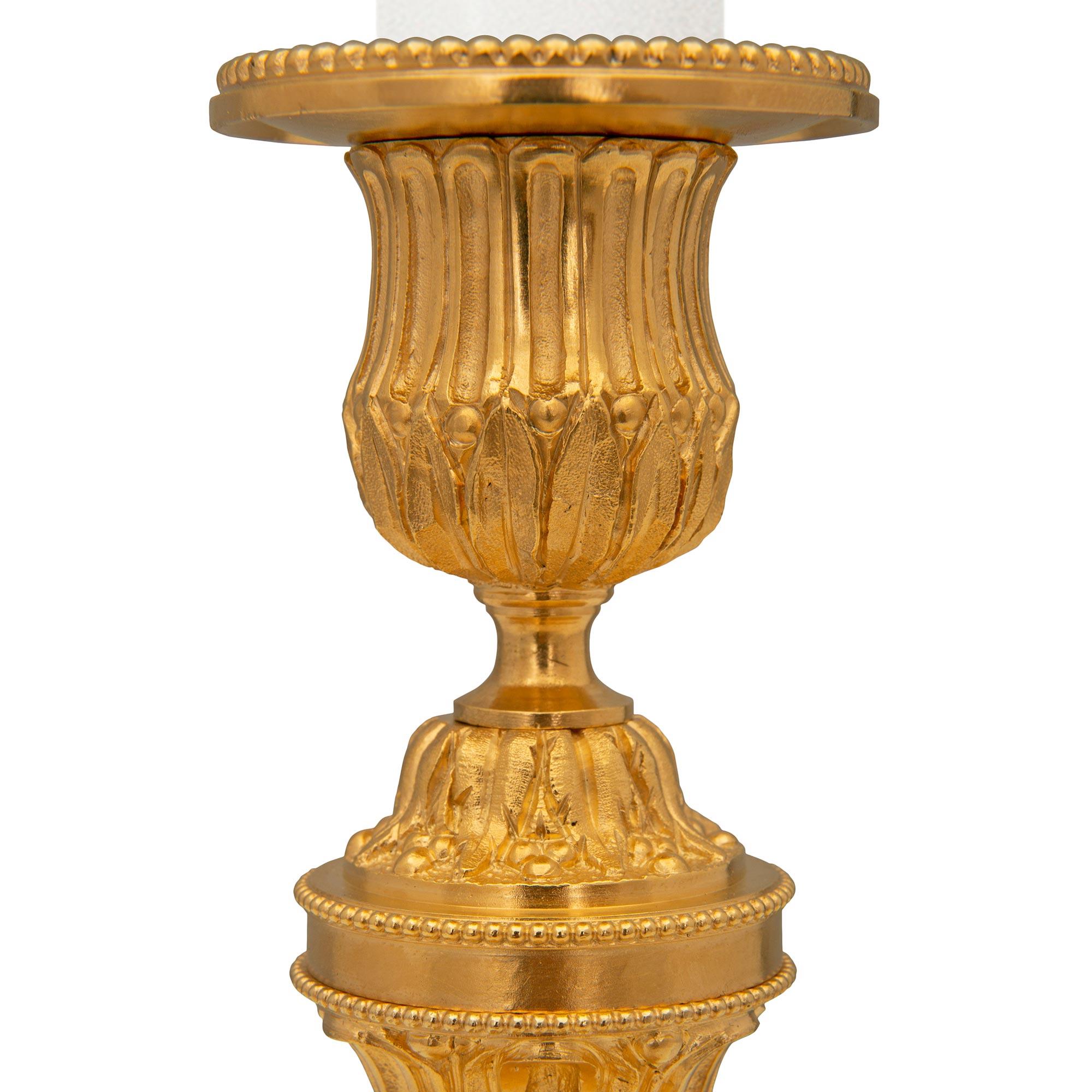 Pair of French 19th Century Louis XVI St. Ormolu Candlesticks In Good Condition For Sale In West Palm Beach, FL