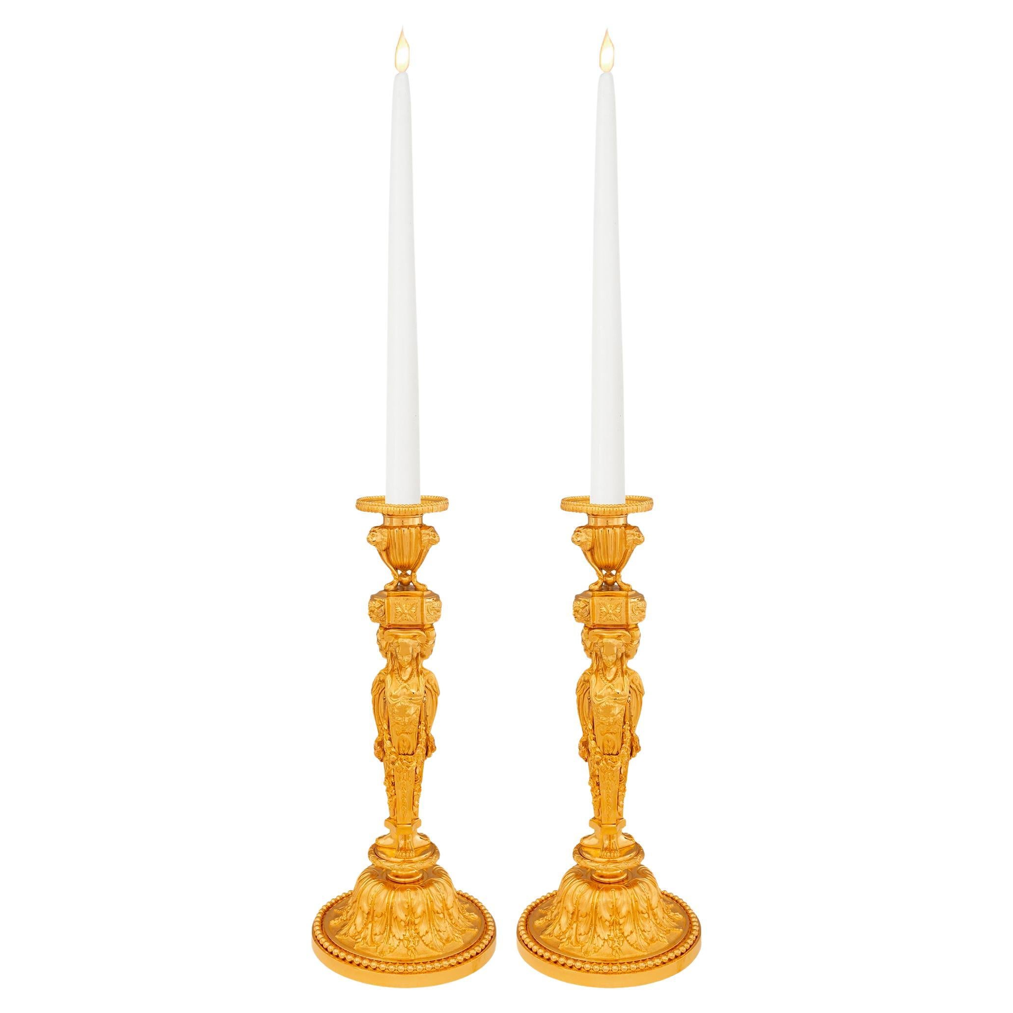 Pair of French 19th century Louis XVI st. Ormolu candlesticks.