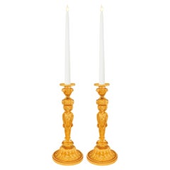Pair of French 19th century Louis XVI st. Ormolu candlesticks.