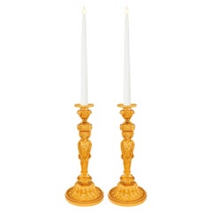 Pair of French 19th century Louis XVI st. Ormolu candlesticks.