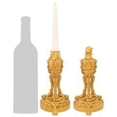 pair of French 19th century Louis XVI st. Ormolu cassolette candlesticks