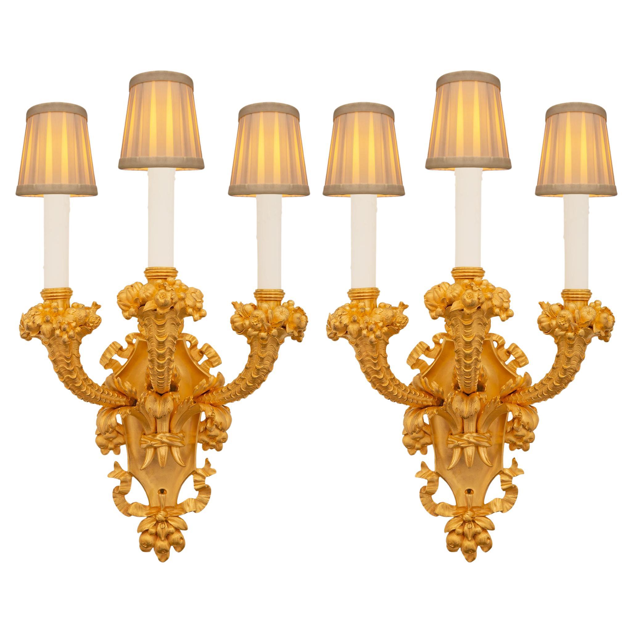 pair of French 19th century Louis XVI st. Ormolu sconces, stamped Caldwell & Co.