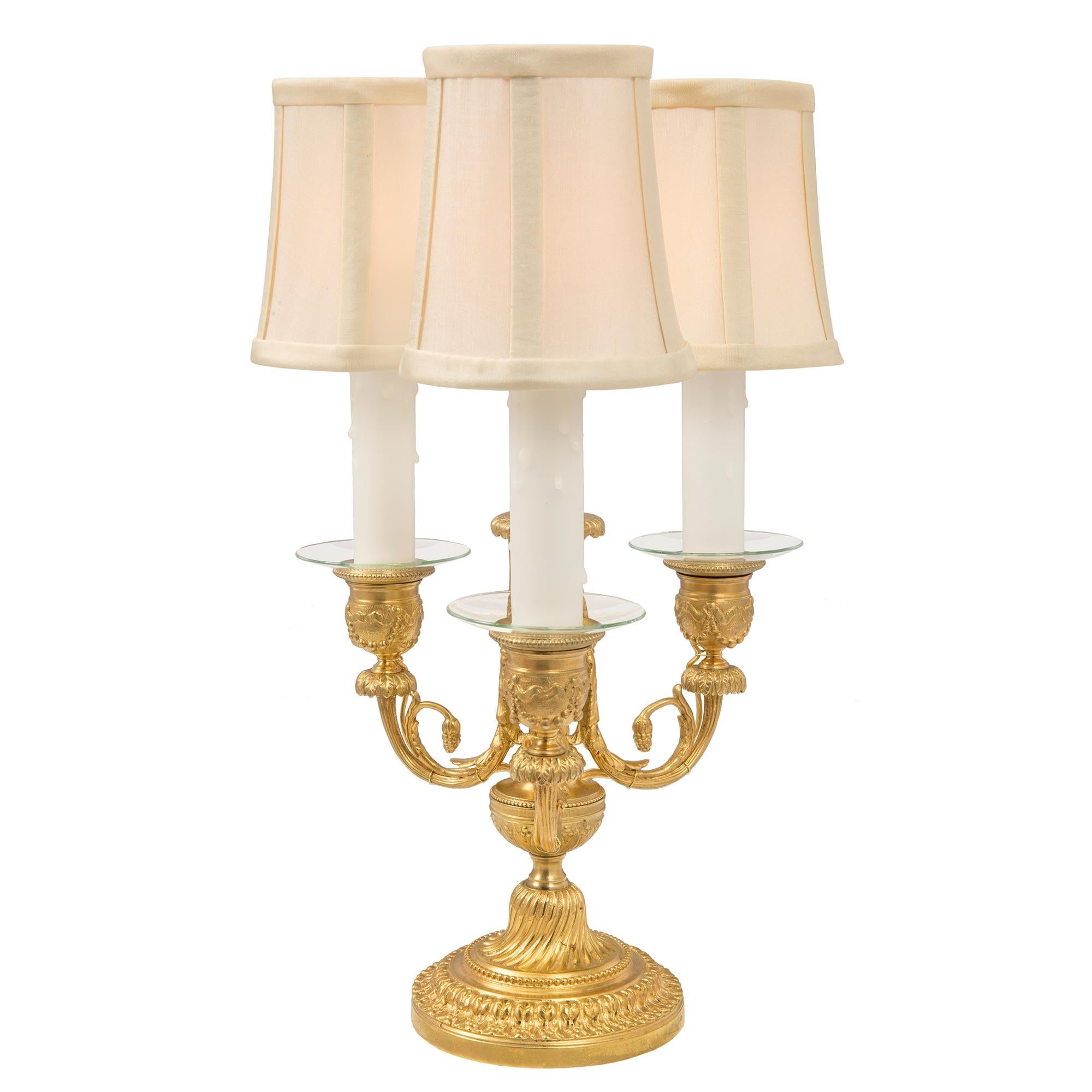 Pair of French 19th Century Louis XVI St. Ormolu Three Arm Candelabra Lamps In Good Condition For Sale In West Palm Beach, FL