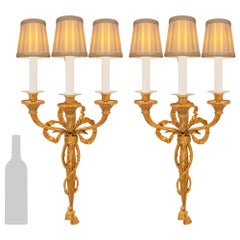 Pair of French 19th Century Louis XVI St. Ormolu Three Arm Sconces