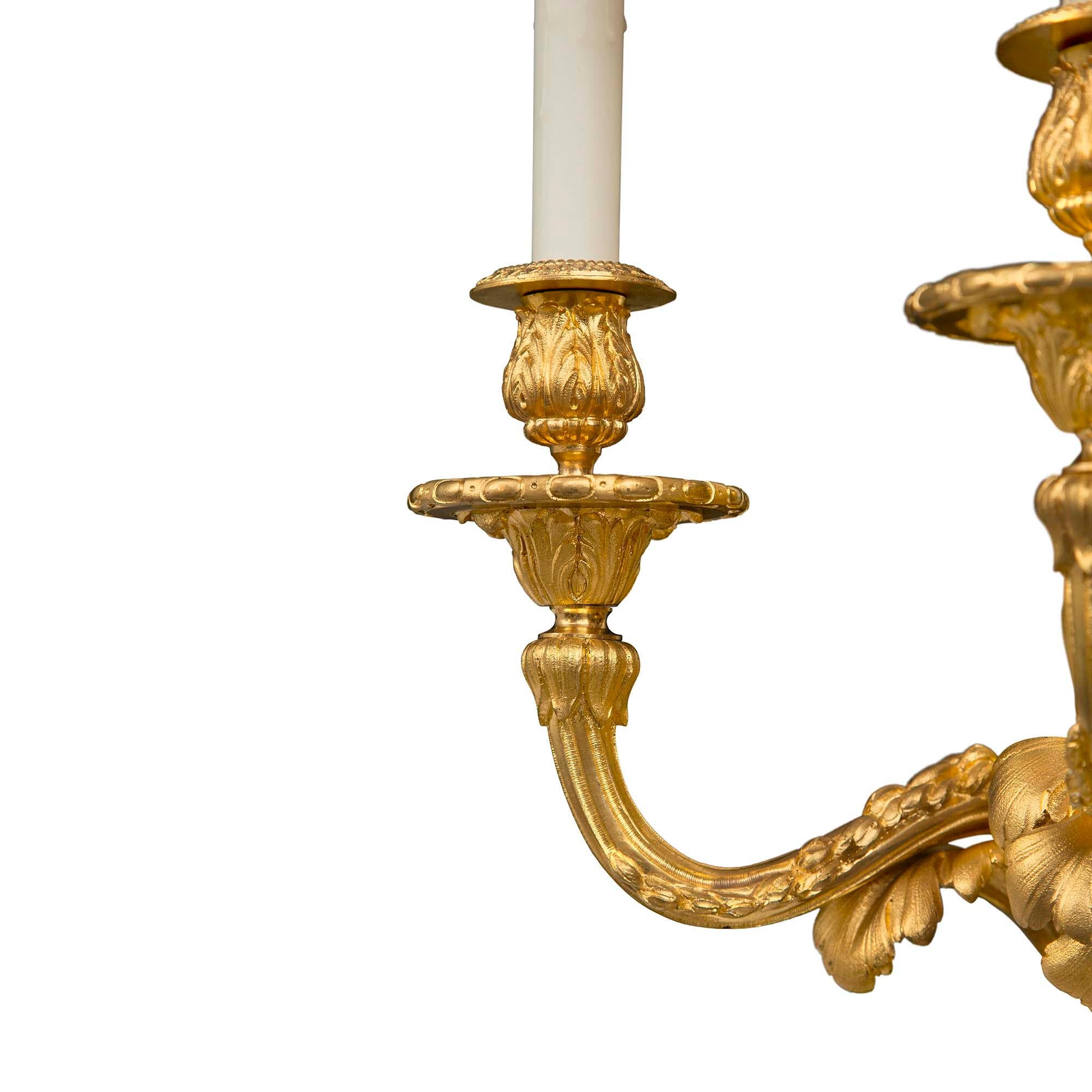 Pair of French 19th Century Louis XVI St. Ormolu Three-Arm Sconces In Good Condition For Sale In West Palm Beach, FL
