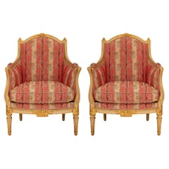 Pair of French 19th Century Louis XVI St. Patinated and Giltwood Armchairs