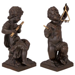 Pair of French 19th Century Louis XVI St. Patinated Bronze and Ormolu Statues
