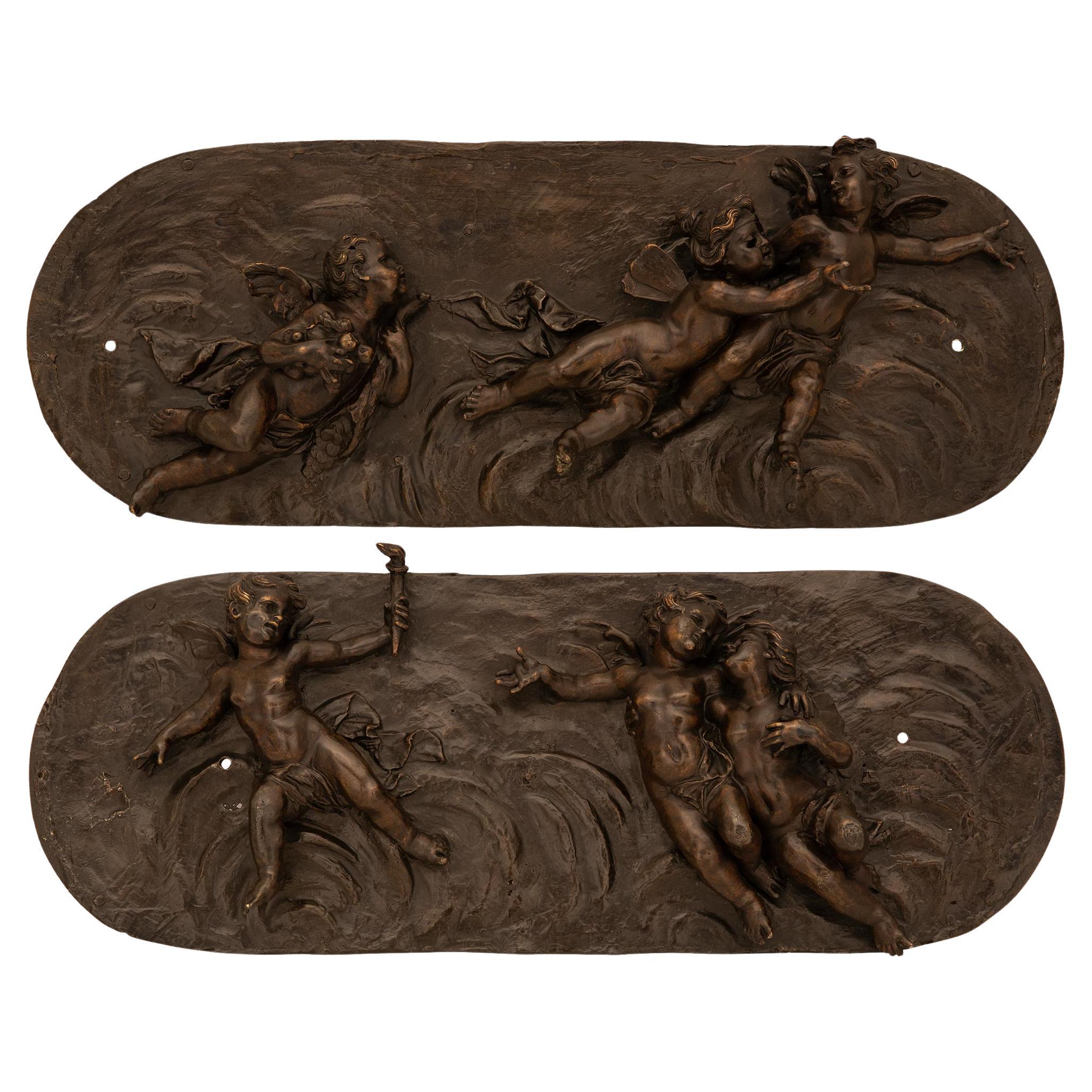 pair of French 19th century Louis XVI st. Patinated Bronze wall plaques