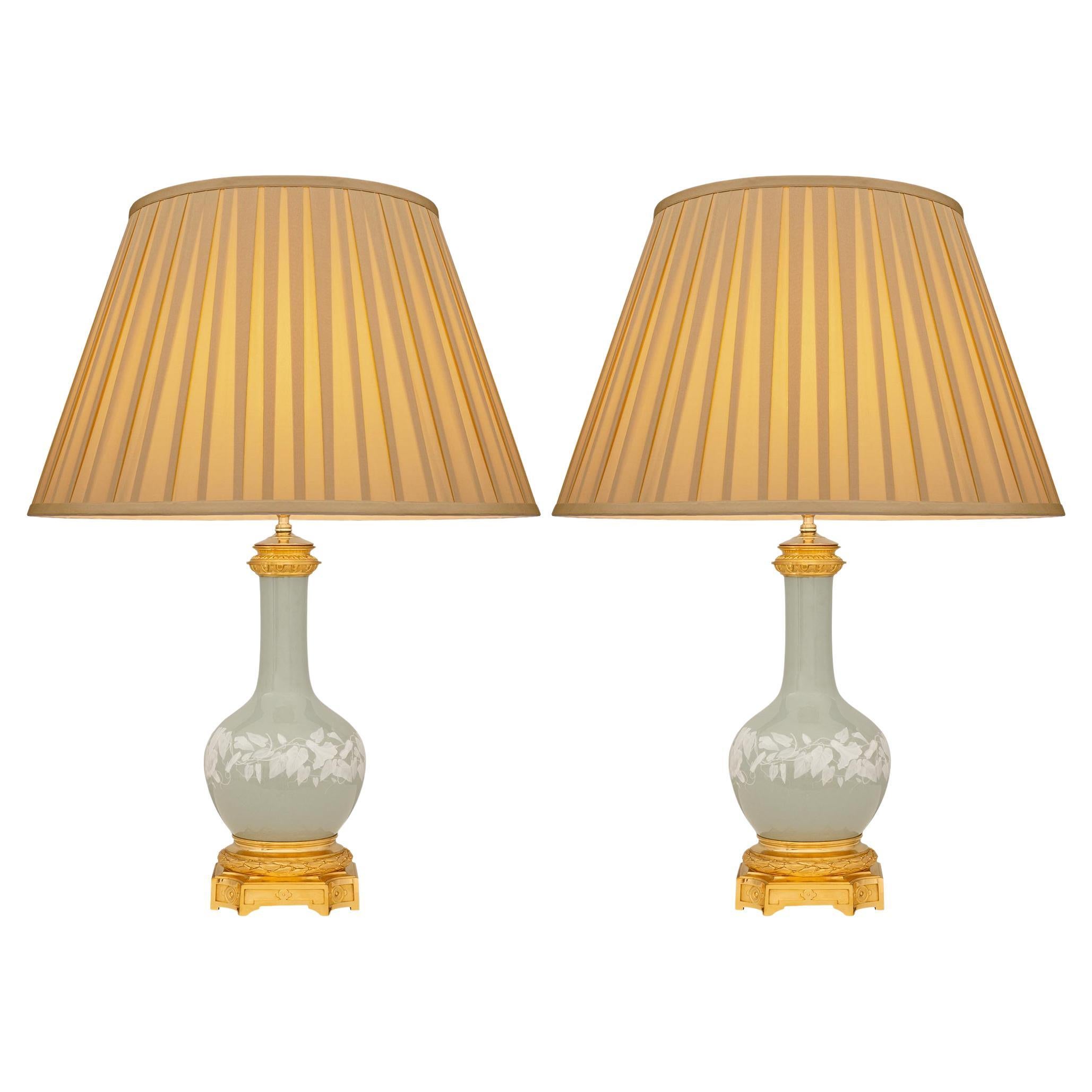 pair of French 19th century Louis XVI st. Porcelain and Ormolu lamps