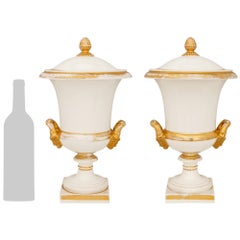 pair of French 19th century Louis XVI st. Porcelaine and Gilt wine buckets/urns