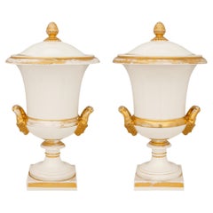 pair of French 19th century Louis XVI st. Porcelaine and Gilt wine buckets/urns