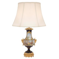 Pair of French 19th Century Louis XVI St. Sèvres Porcelain and Ormolu Lamps