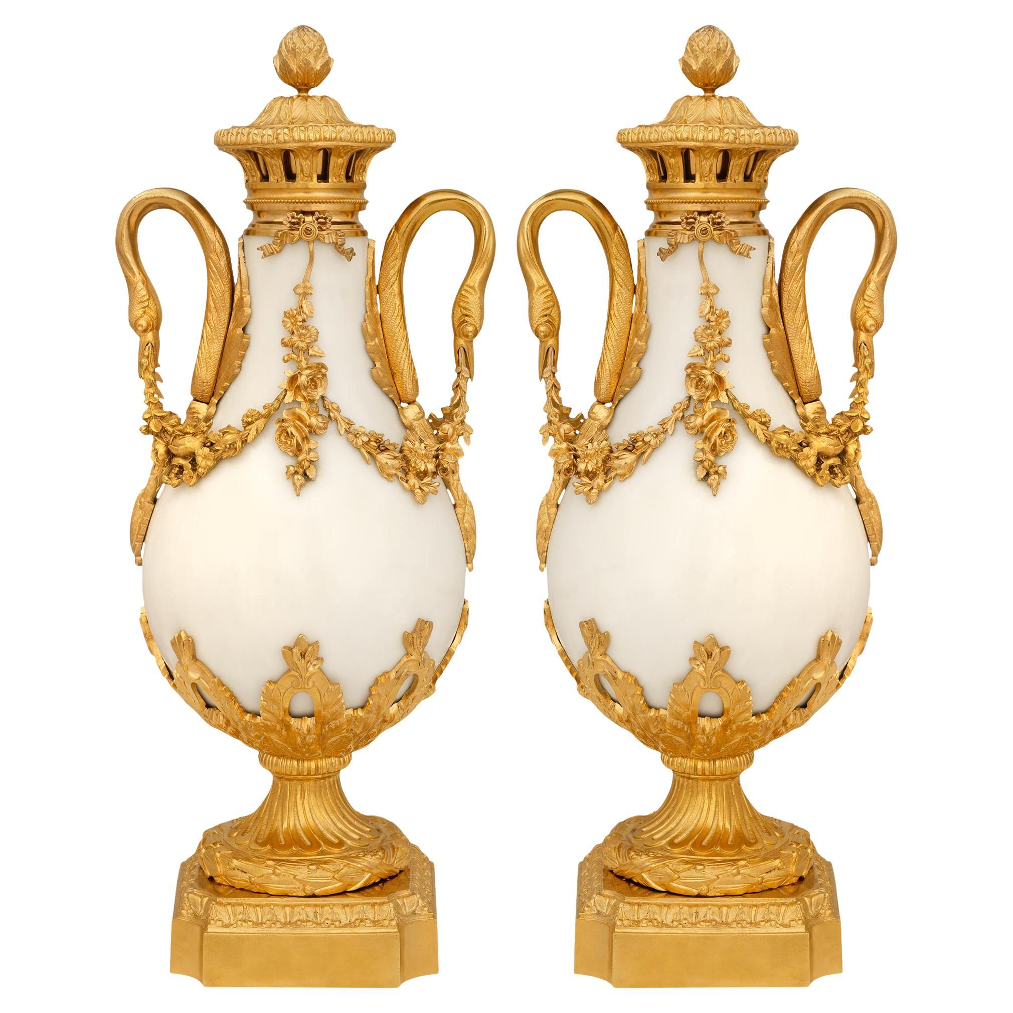 pair of French 19th century Louis XVI st. white Carrara marble and Ormolu urns