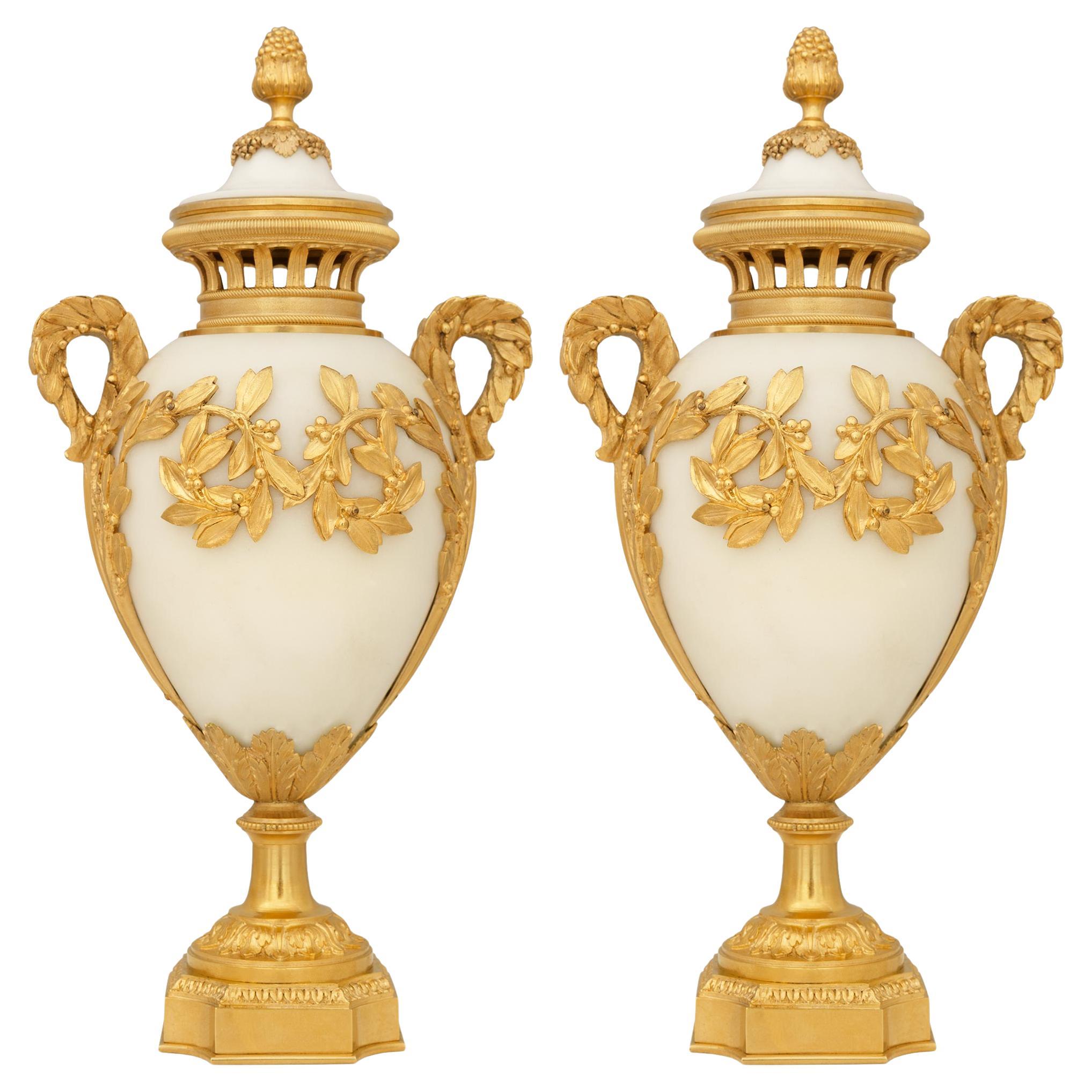 pair of French 19th century Louis XVI st. white Carrara marble and Ormolu urns