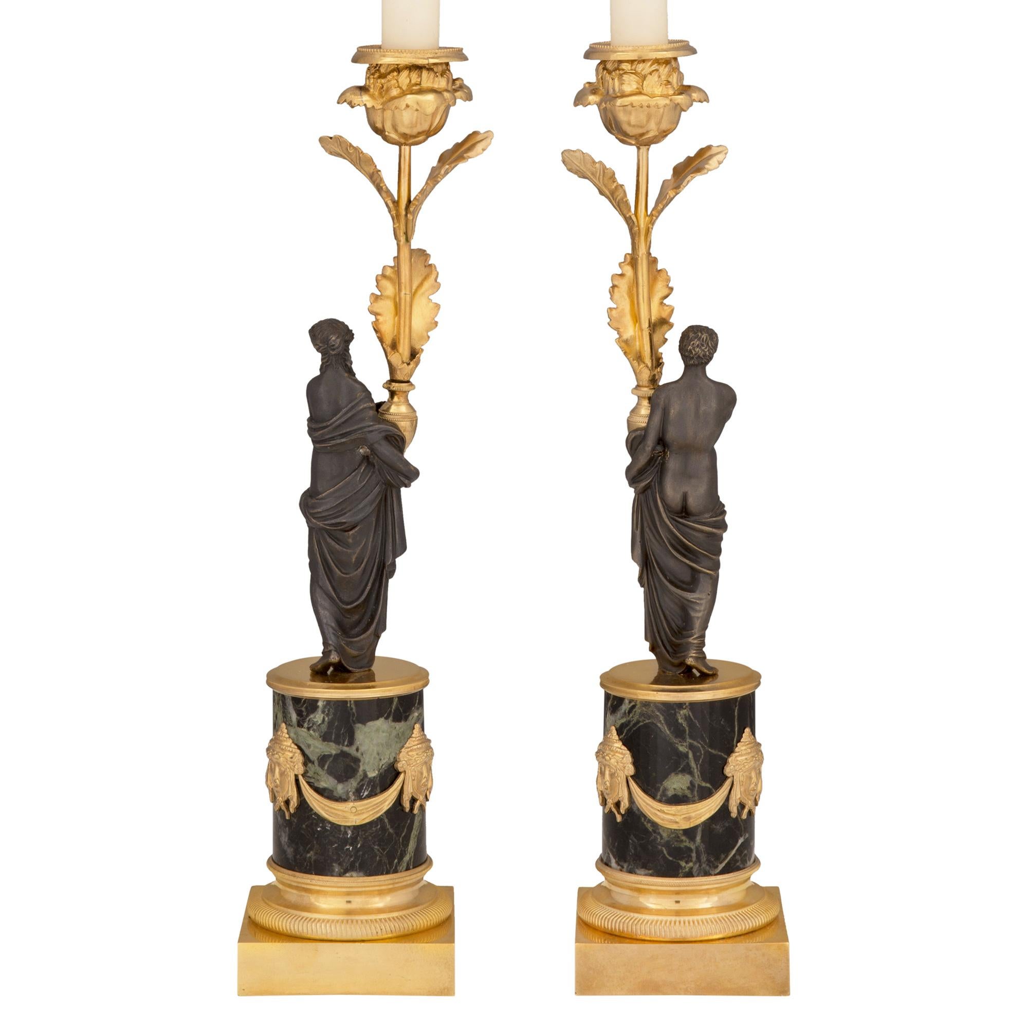 Patinated Pair of French 19th Century Louis XVI Style Bronze and Marble Candlesticks For Sale