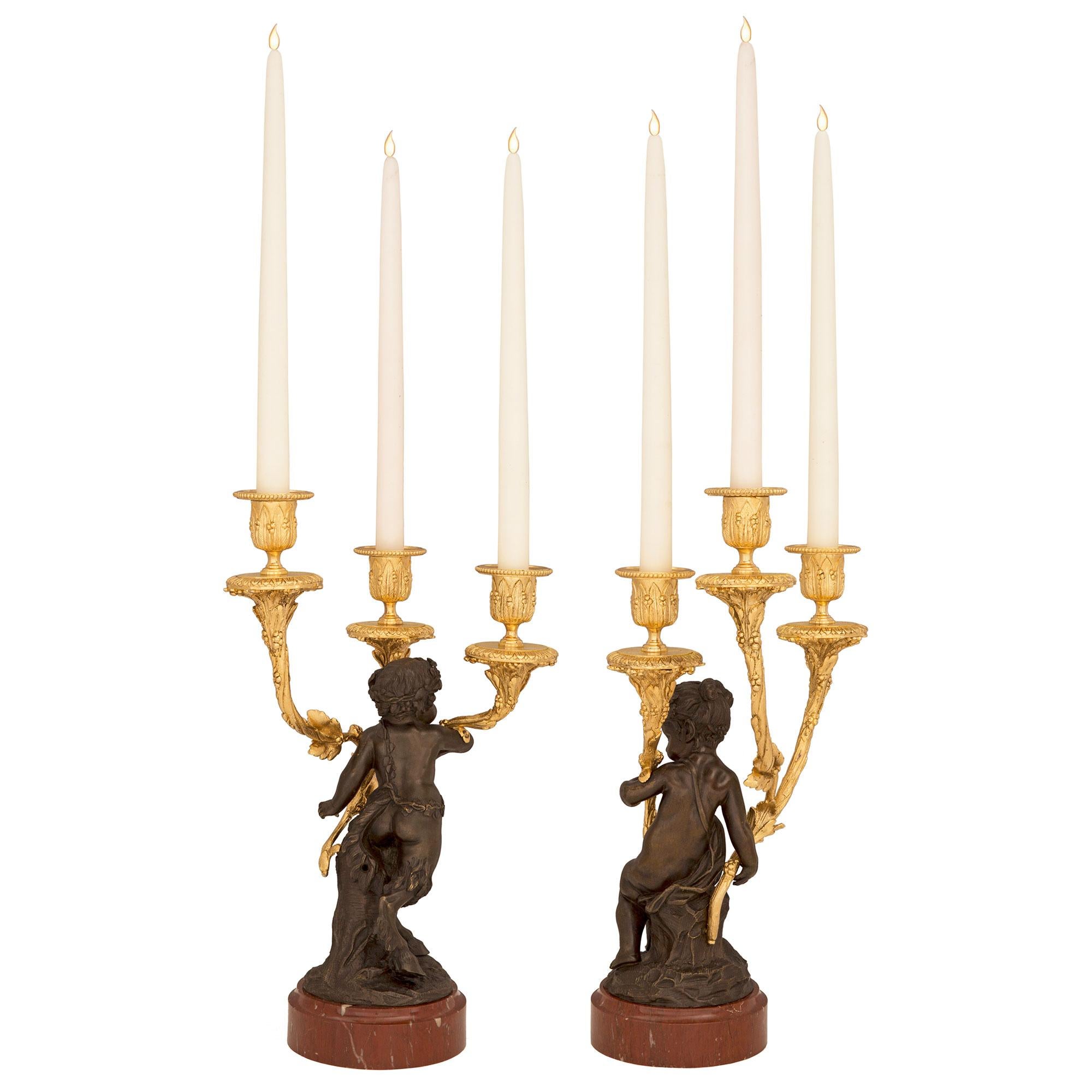 Patinated Pair of French 19th Century Louis XVI Style Candelabras, Attributed to Clodion For Sale