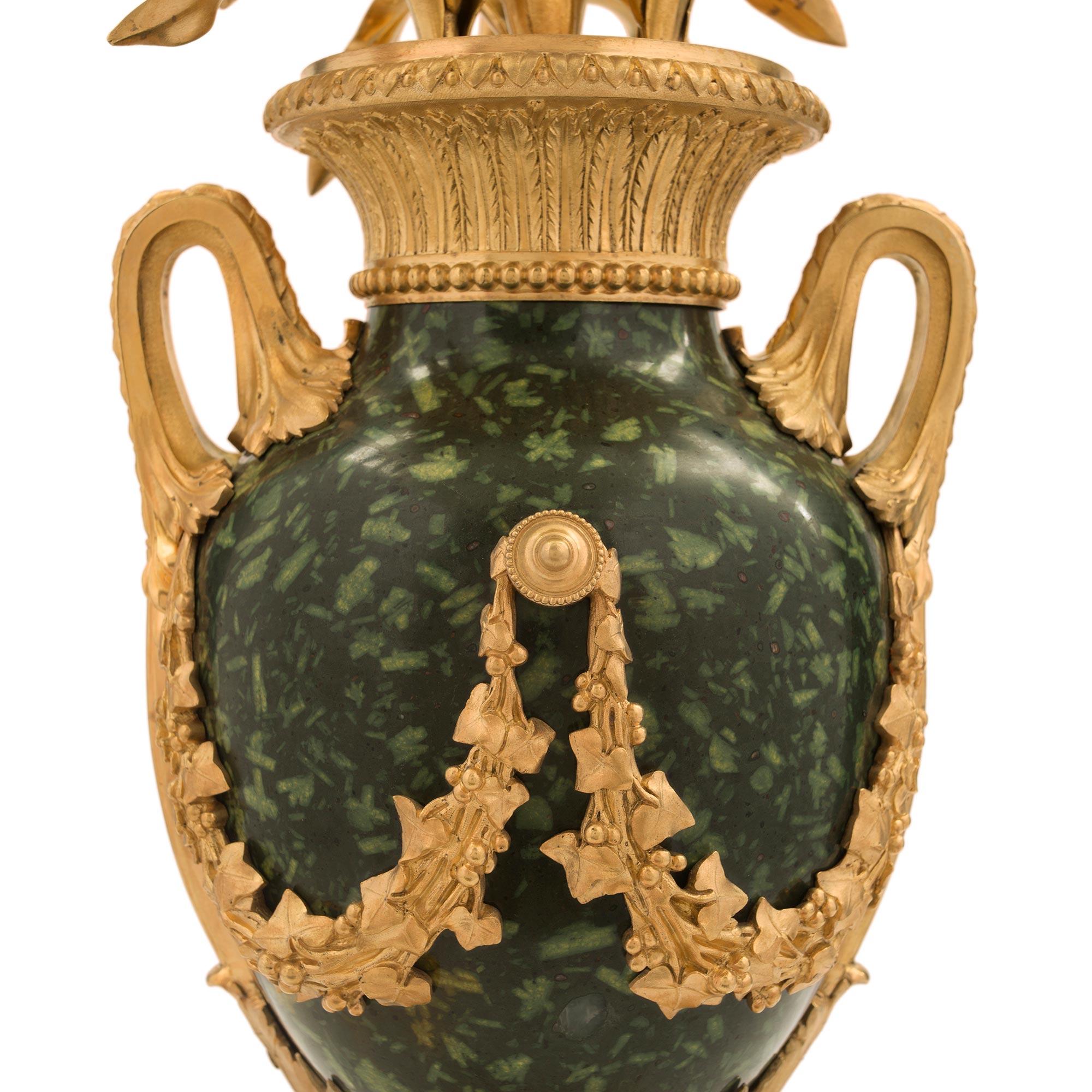 XIX secolo Pair of French 19th Century Louis XVI Style Four-Arm Candelabras in vendita