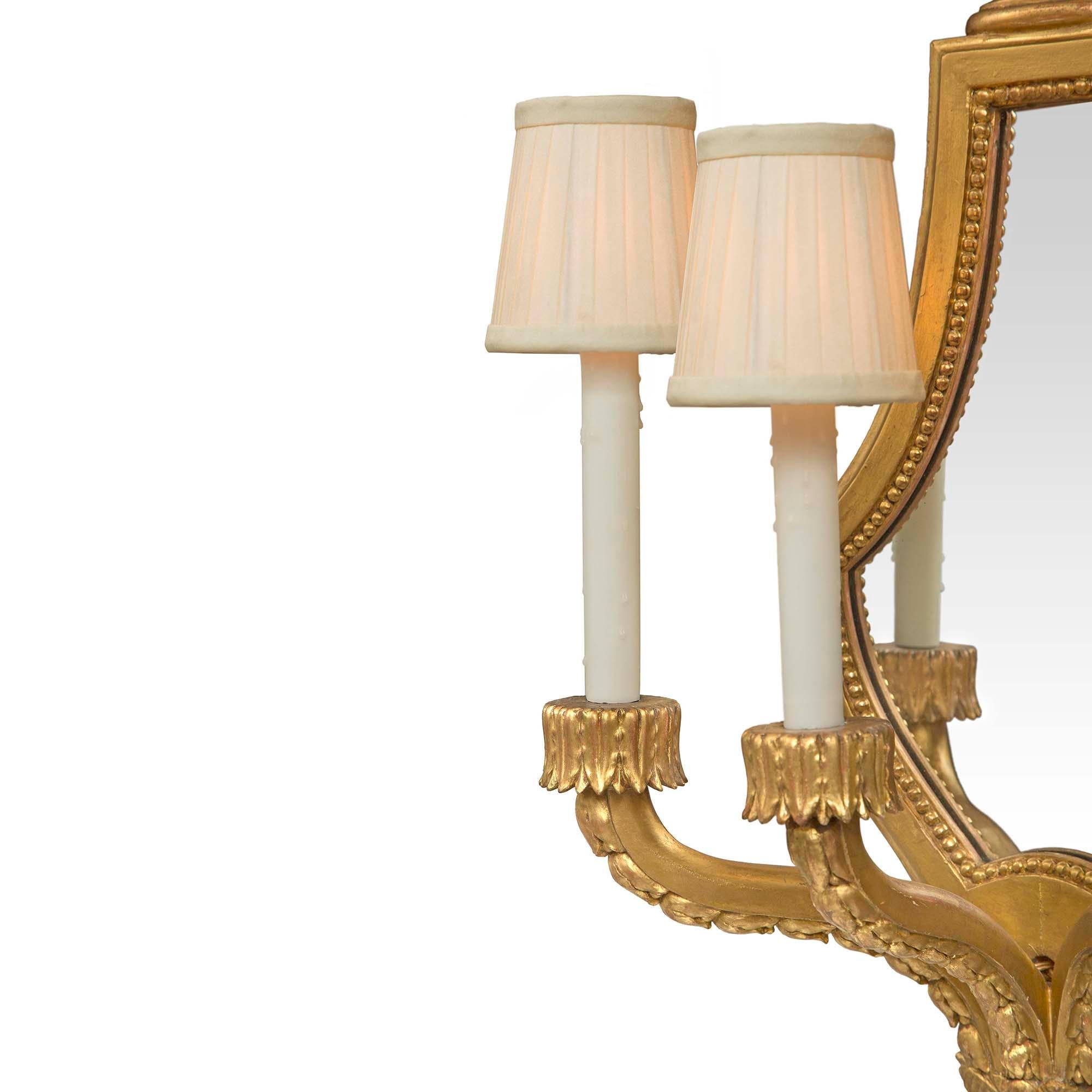 Pair of French 19th Century Louis XVI Style Giltwood Mirrored Sconces In Good Condition For Sale In West Palm Beach, FL