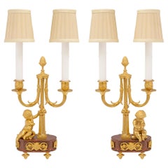 Paire de lampes de style Louis XVI du 19ème siècle en marbre griotte et bronze doré