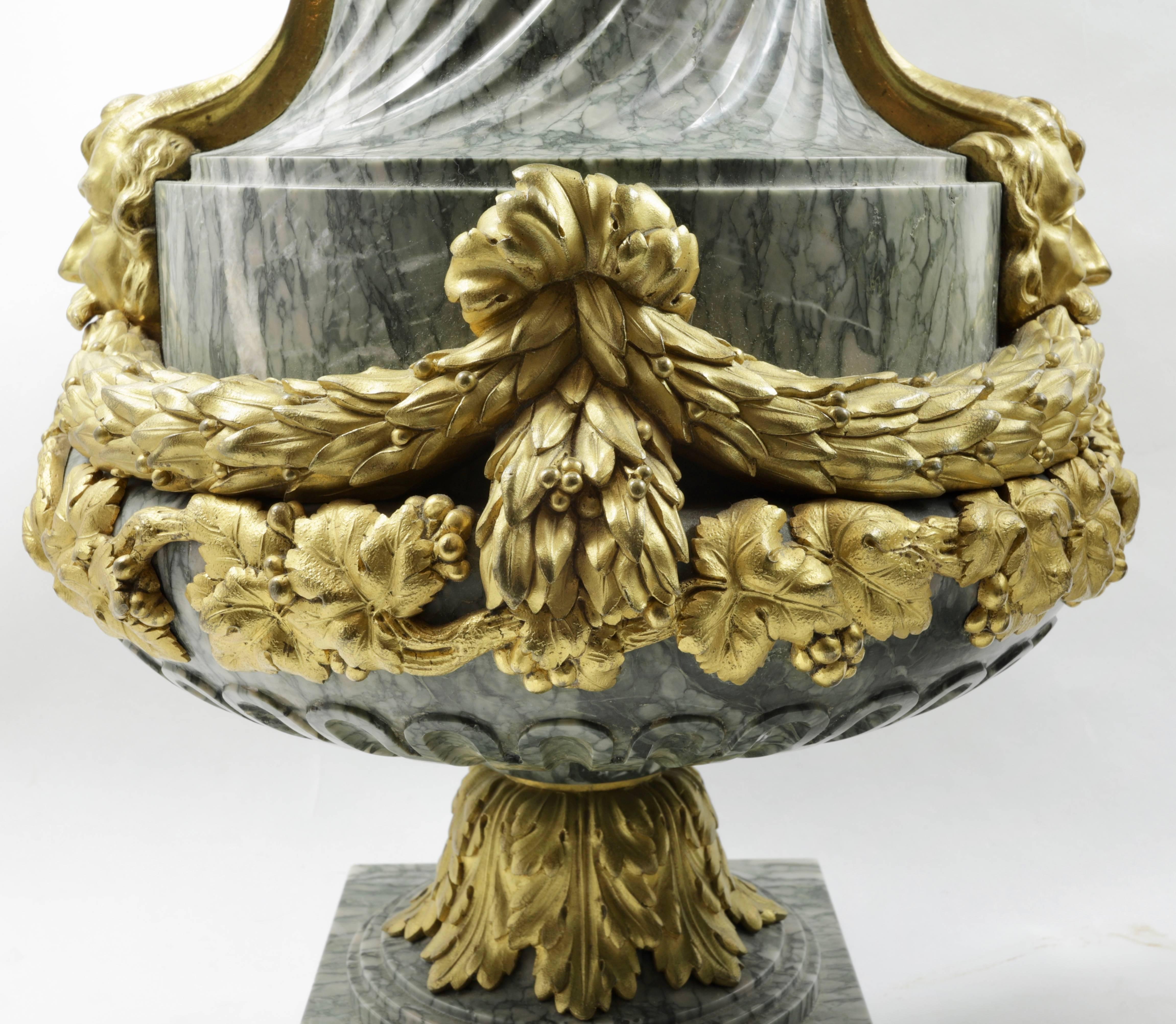Pair of finest quality French 19th century Louis XVI style marble and gilt bronze urns.