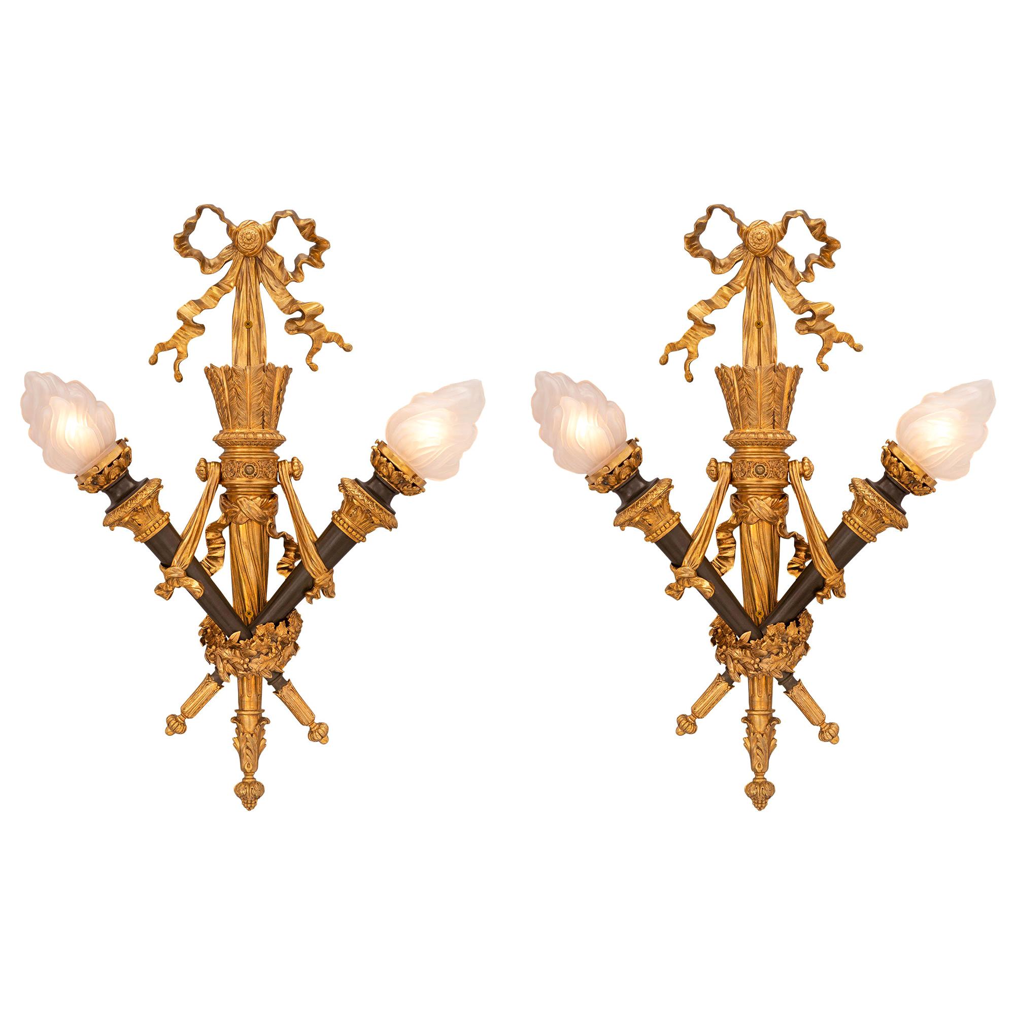 Pair of French 19th Century Louis XVI Style Ormolu and Patinated Bronze Sconces For Sale
