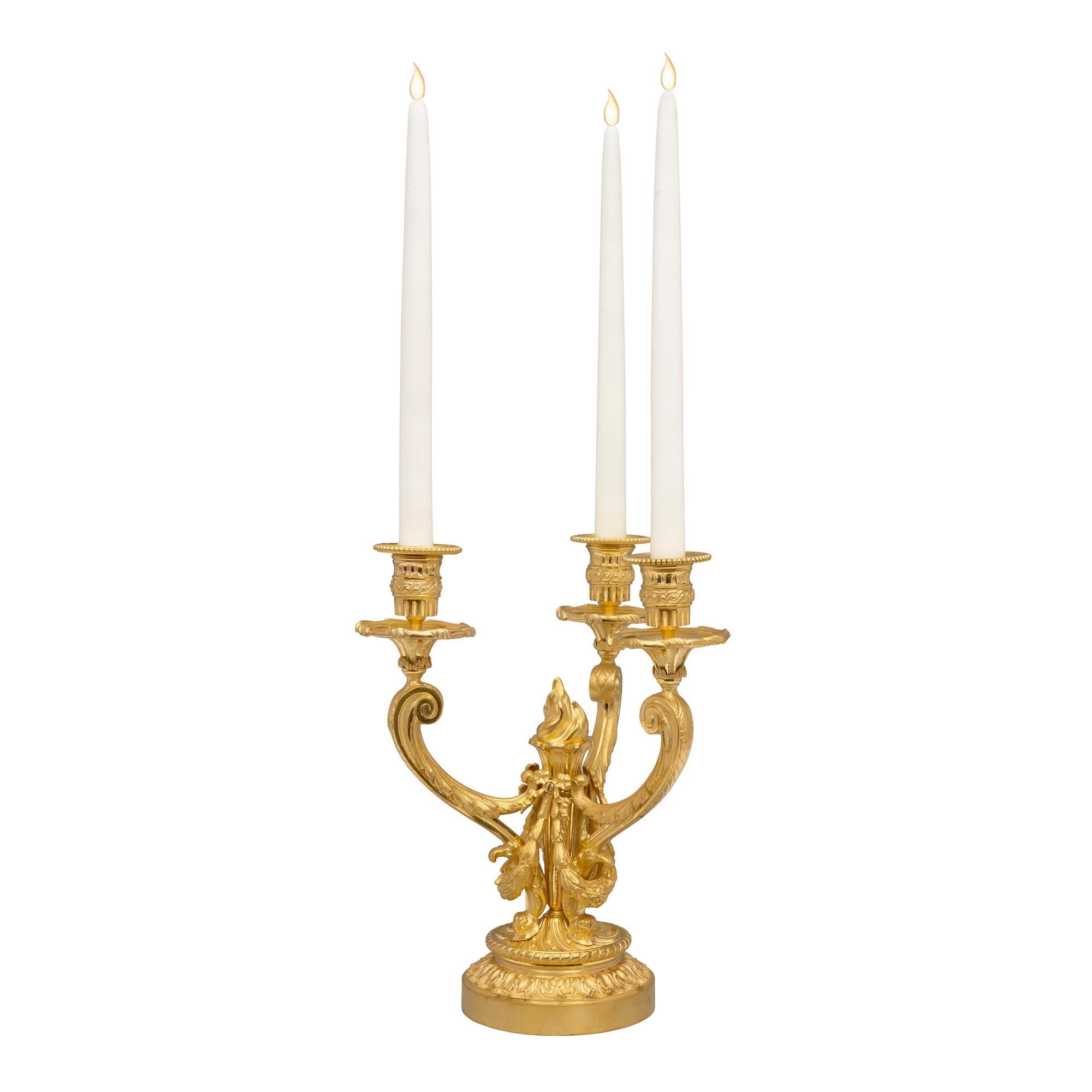 Pair of French 19th Century Louis XVI Style Ormolu Three-Arm Candelabras In Good Condition For Sale In West Palm Beach, FL