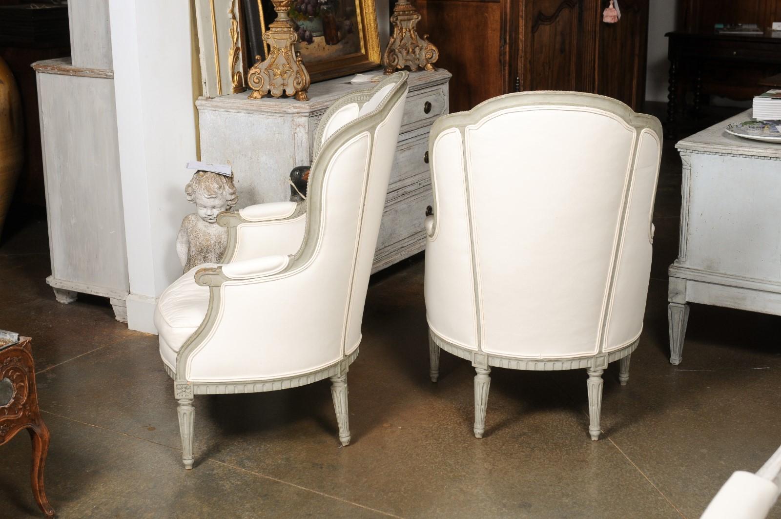 Pair of French 19th Century Louis XVI Style Painted Bergères with Upholstery For Sale 11