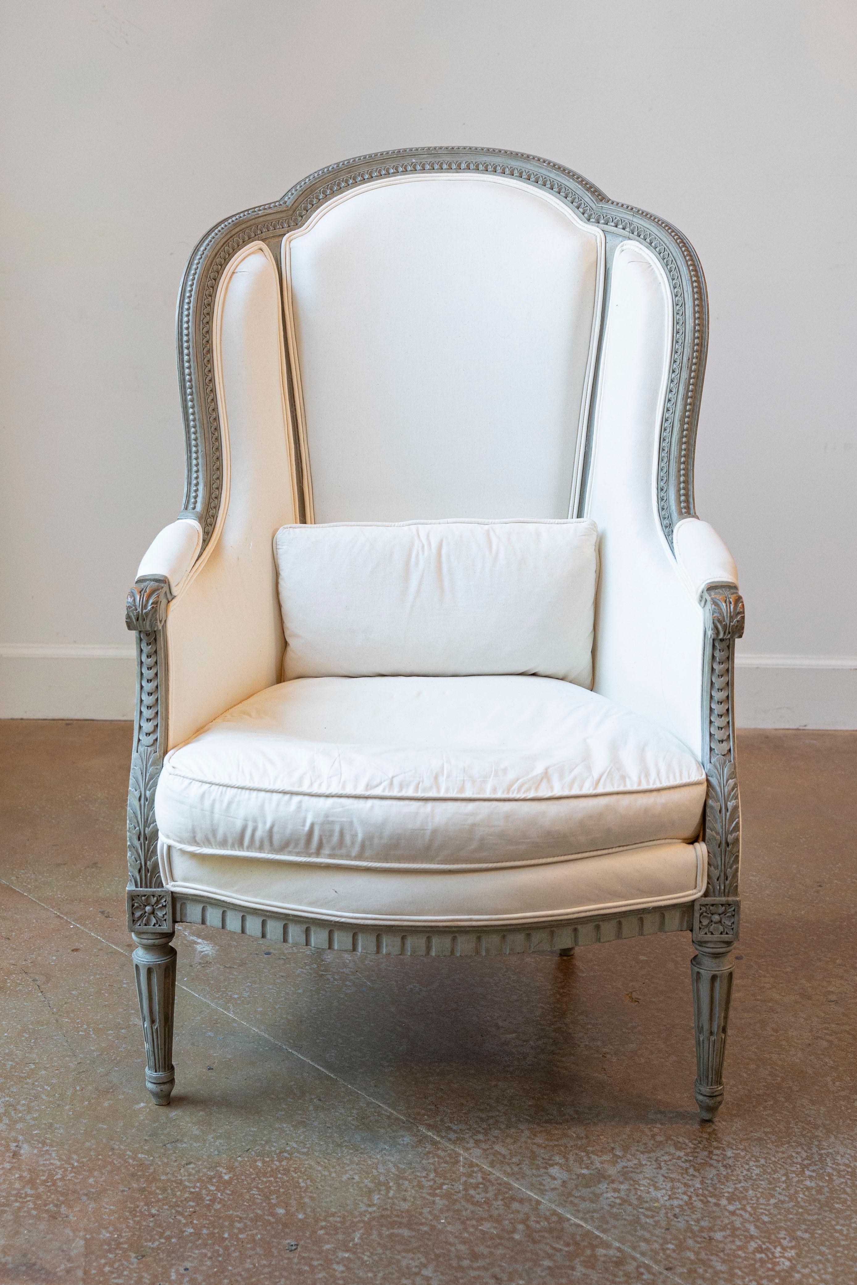 Carved Pair of French 19th Century Louis XVI Style Painted Bergères with Upholstery For Sale