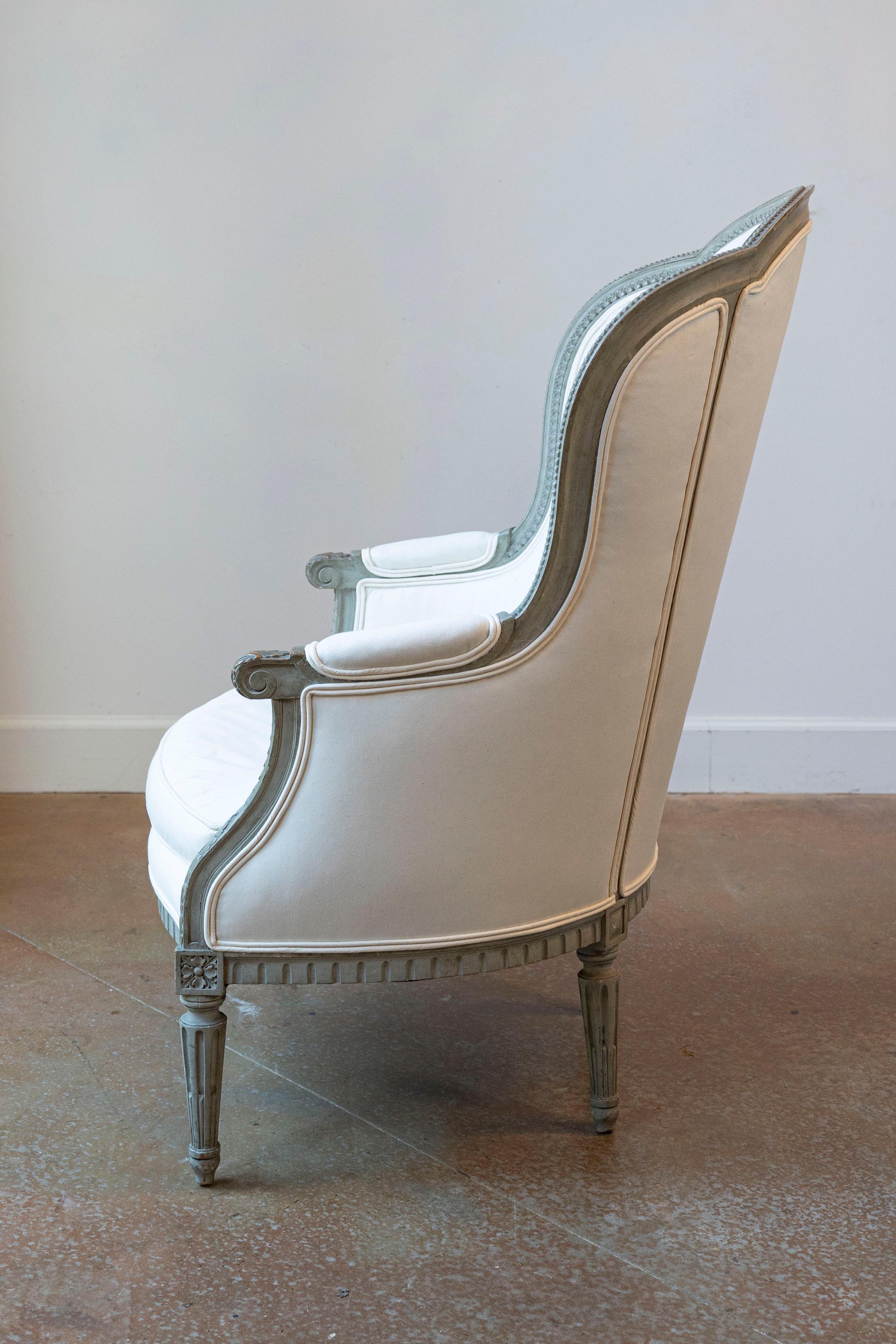 Pair of French 19th Century Louis XVI Style Painted Bergères with Upholstery For Sale 1