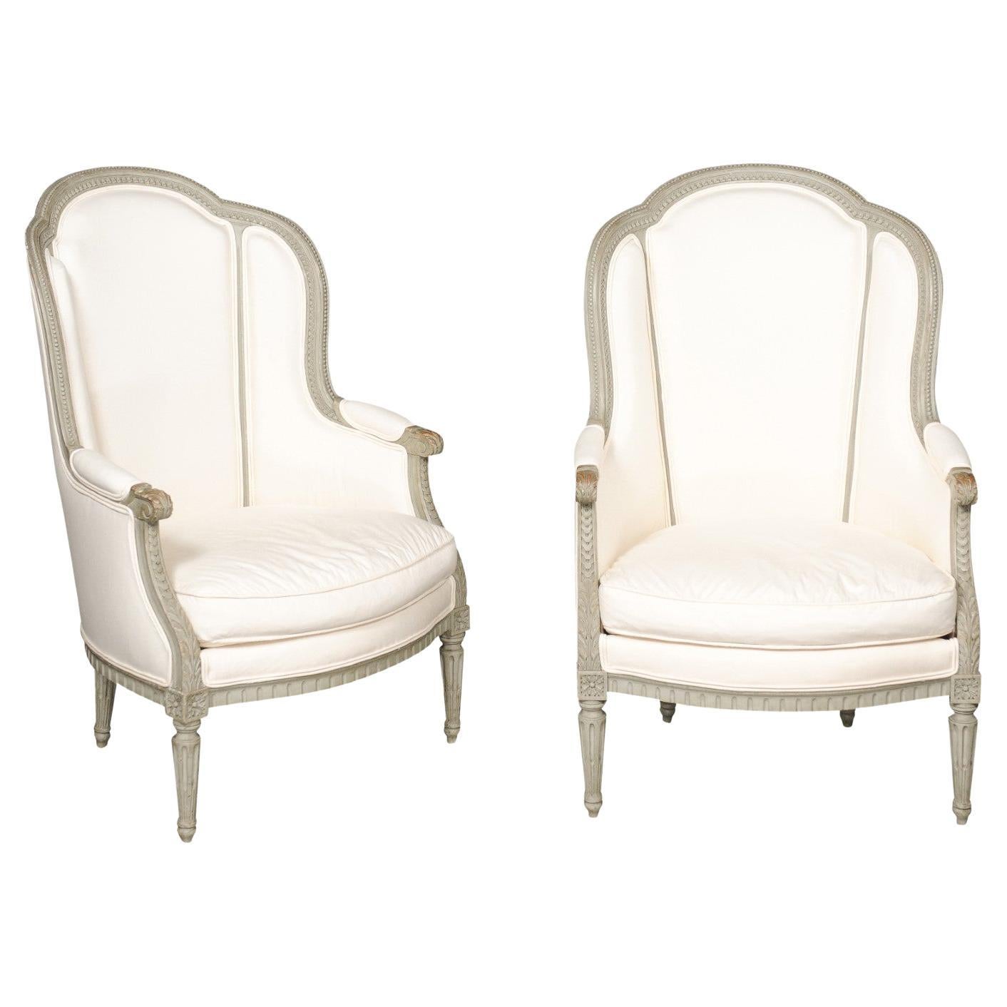 Pair of French 19th Century Louis XVI Style Painted Bergères with Upholstery For Sale