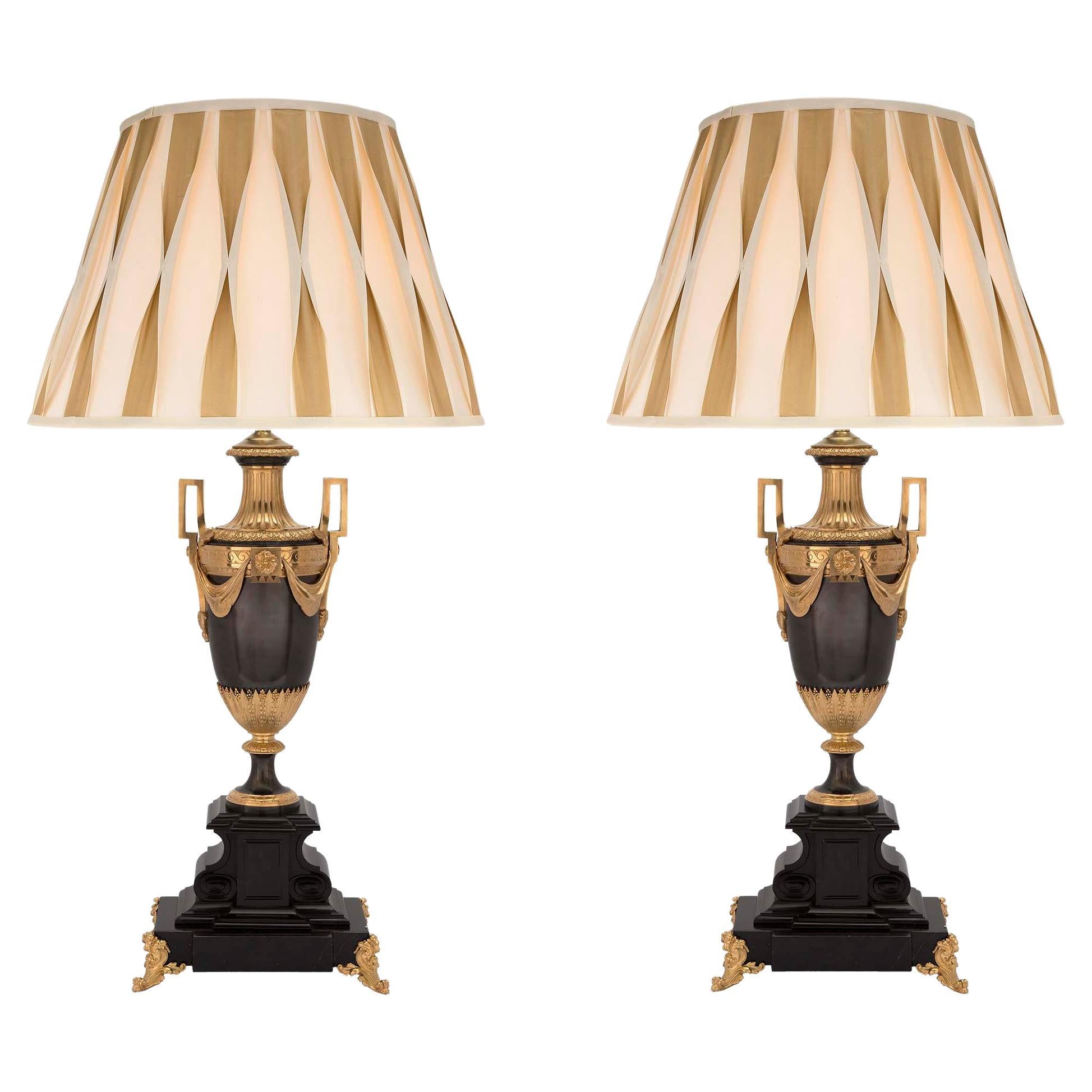 Pair of French 19th Century Louis XVI Style Patinated Bronze and Ormolu Lamps For Sale