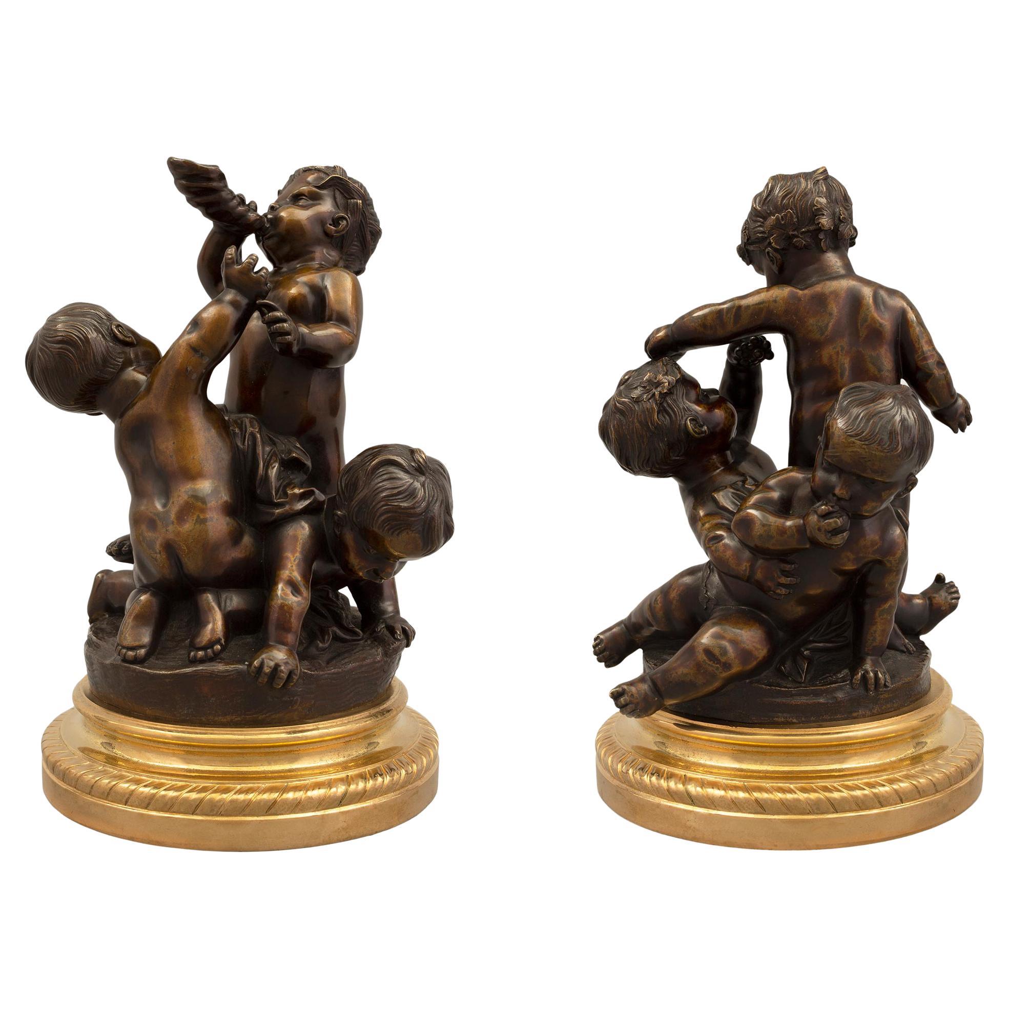 Paire de statues françaises de style Louis XVI du XIXe siècle en bronze patiné et bronze doré
