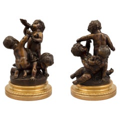 Pair of French 19th Century Louis XVI Style Patinated Bronze and Ormolu Statues