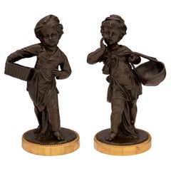  Pair of French 19th Century Louis XVI Style Patinated Bronze and Ormolu Statues