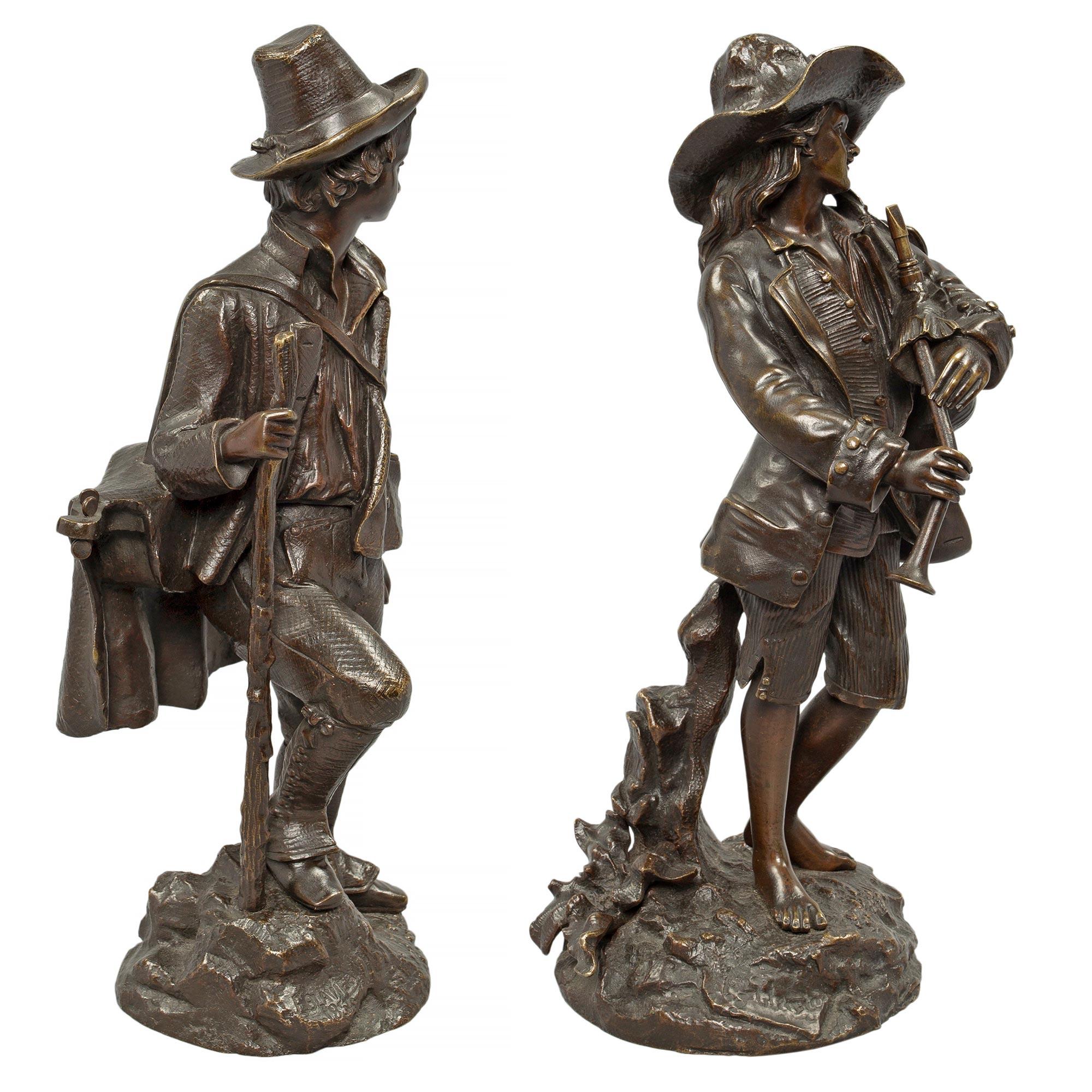 A beautiful and most charming true pair of French 19th century Louis XVI st. patinated bronze statues signed E Blavier. Each statue is raised by a finely executed ground designed base. Above are richly chased personages, one holding a walking stick