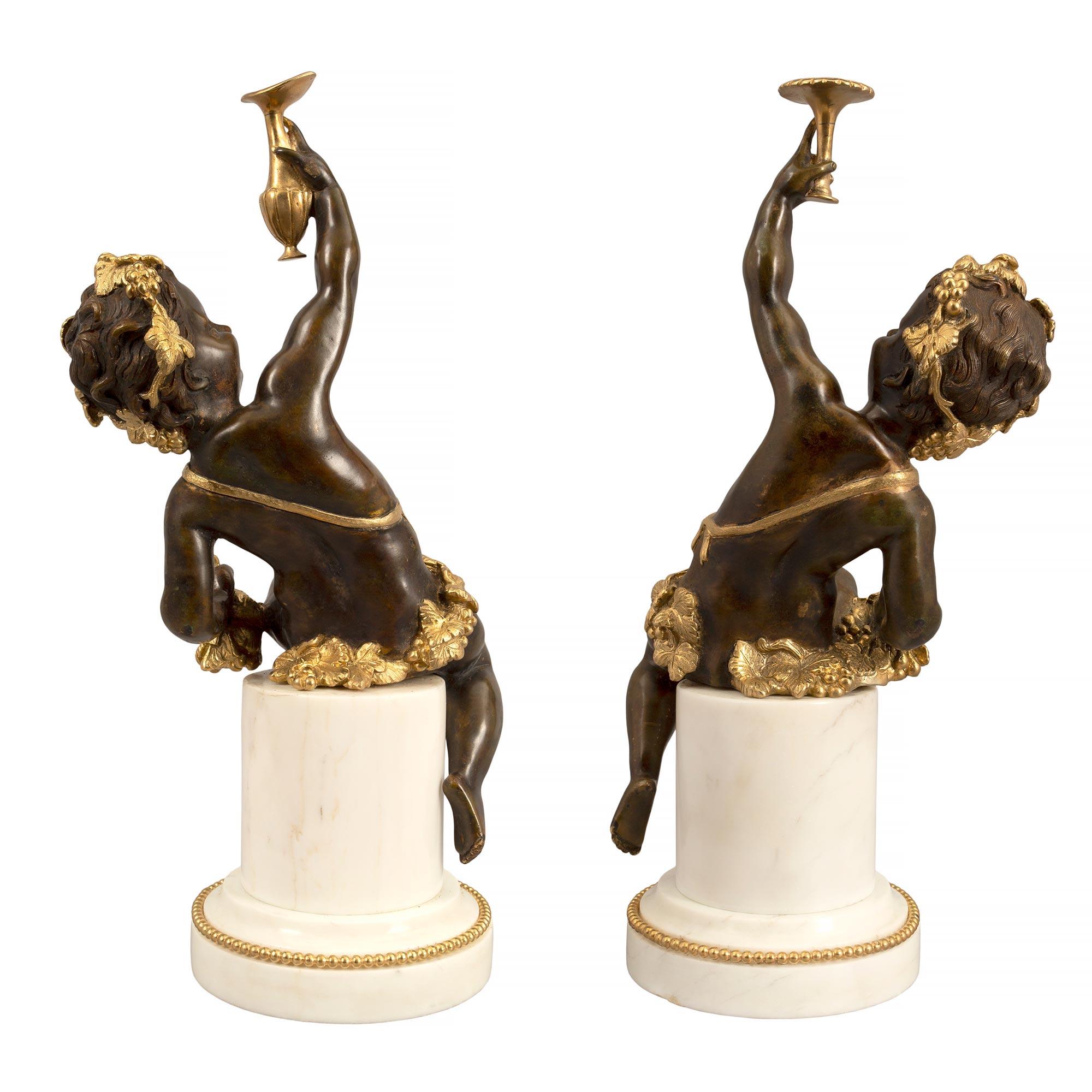 Patinated Pair of French 19th Century Louis XVI Style Statues of Joyful Cherubs