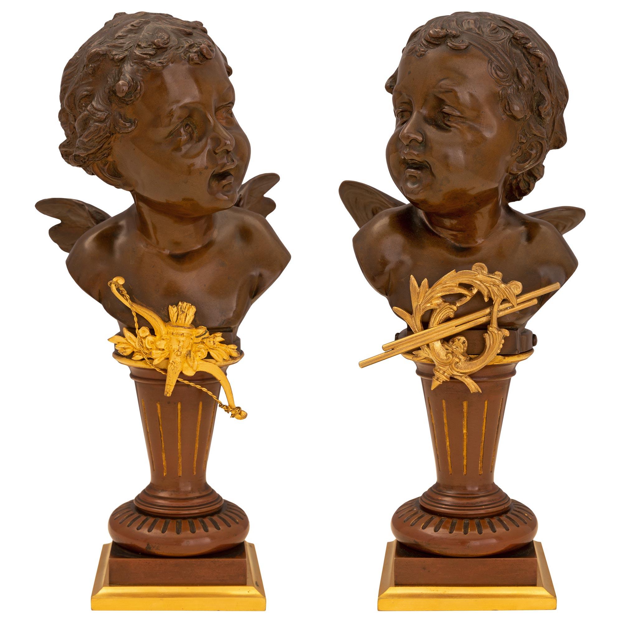 A charming and very high quality true pair of French 19th century Louis XVI st. patinated bronze and ormolu statues, signed Carl Kauba. Each patinated bronze winged cherub is dated 1892 and are raised by a mottled ormolu square base. Above is a