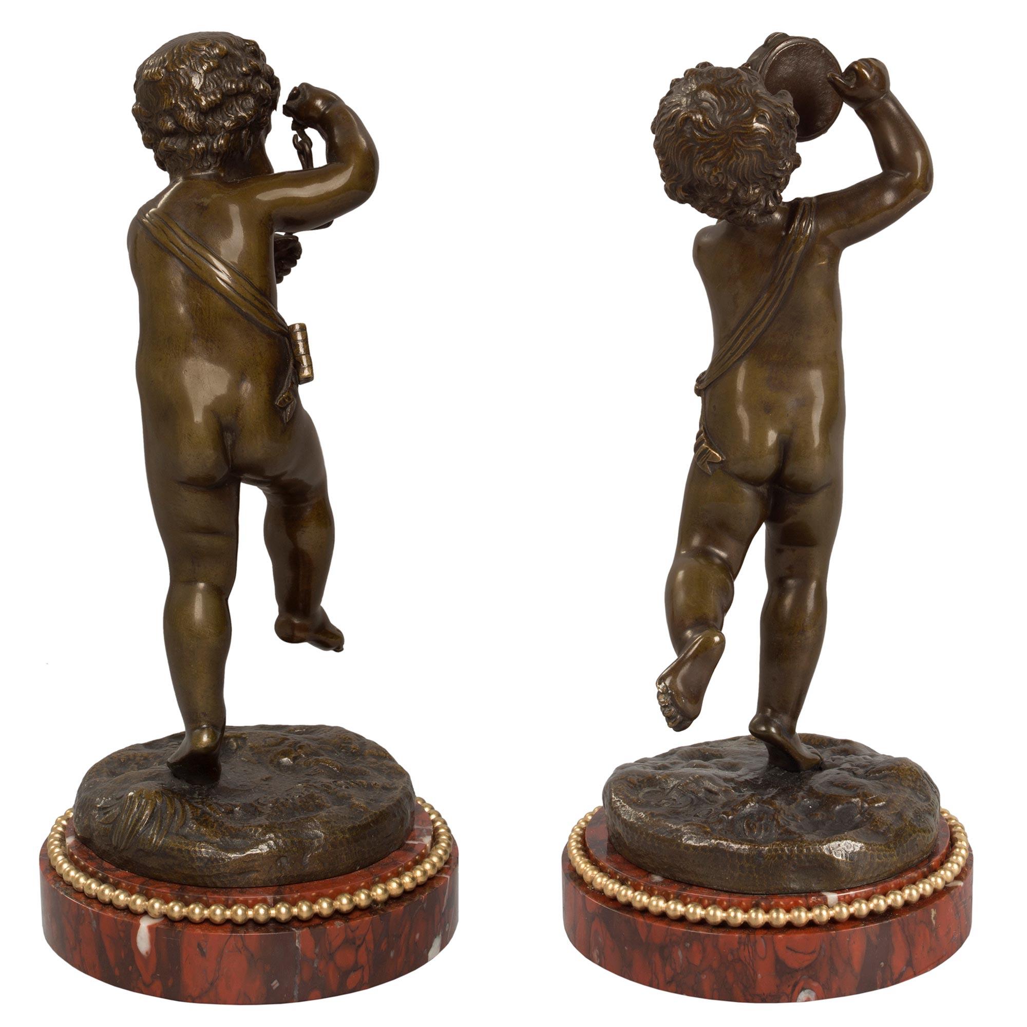 Patinated Pair of French 19th Century Louis XVI Style Statues Signed Clodion For Sale