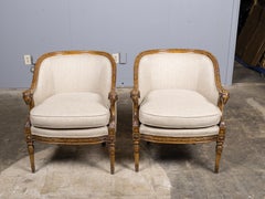 Pair of French 19th Century Louis XVI Style Walnut Bergères with Ram Heads