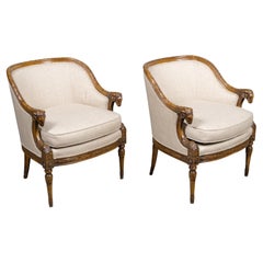 Pair of French 19th Century Louis XVI Style Walnut Bergères with Ram Heads
