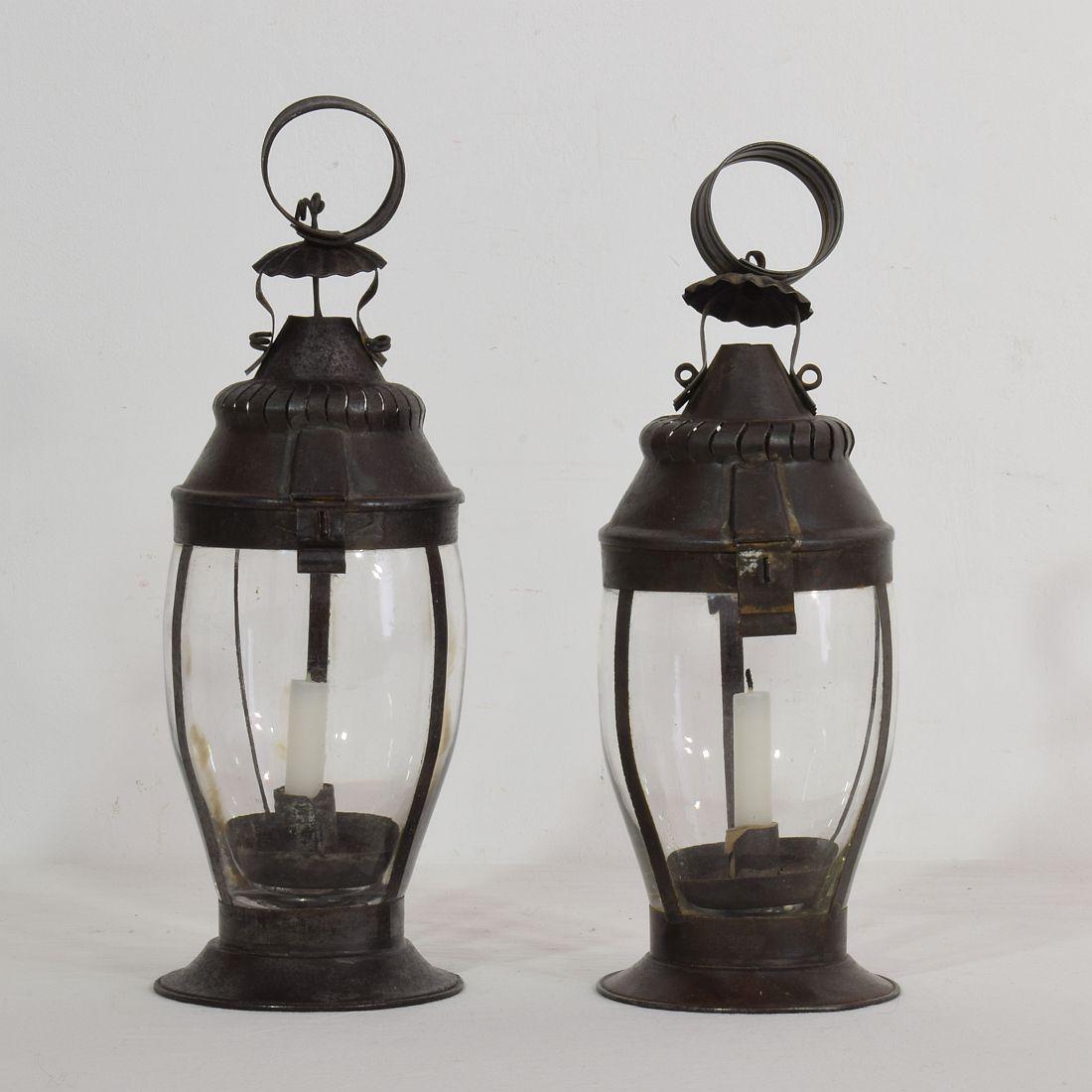 Complete unique pair of metal lanterns, France, circa 1850-1900.
Beautiful weathered but good condition.



   